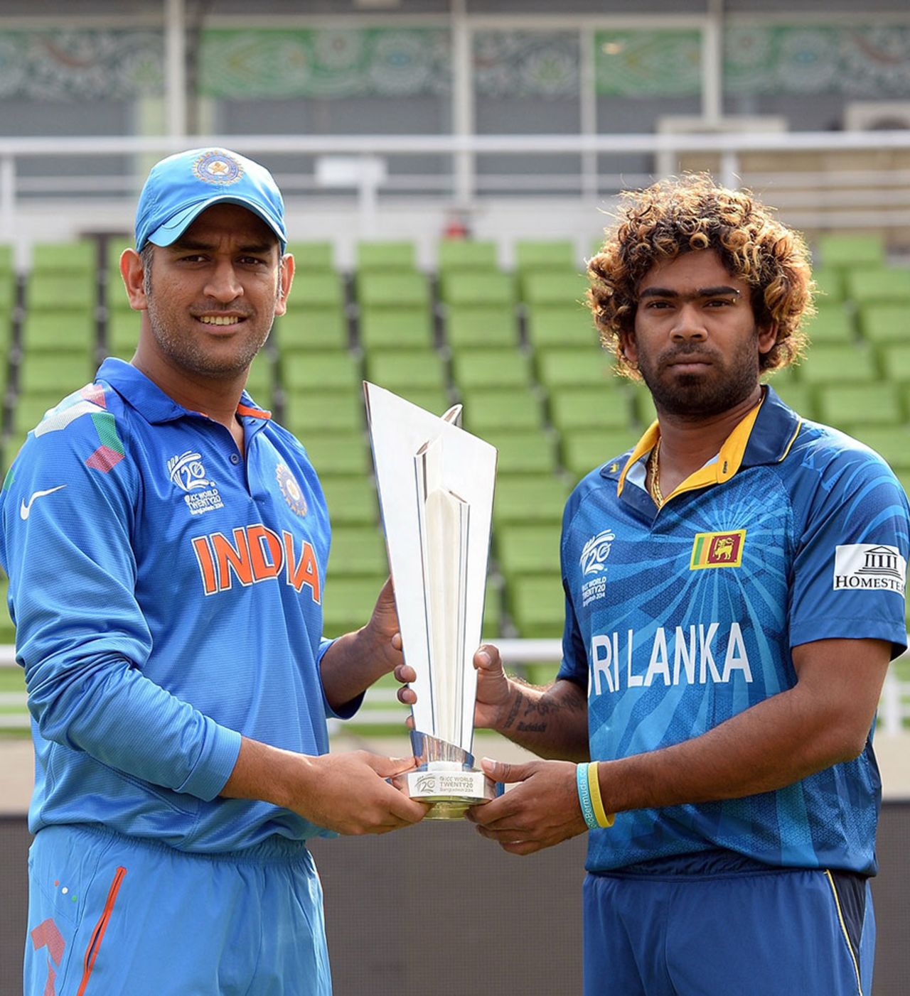 MS Dhoni and Lasith Malinga pose with the World Twenty20 trophy on the eve of the final, Mirpur, April 5, 2014