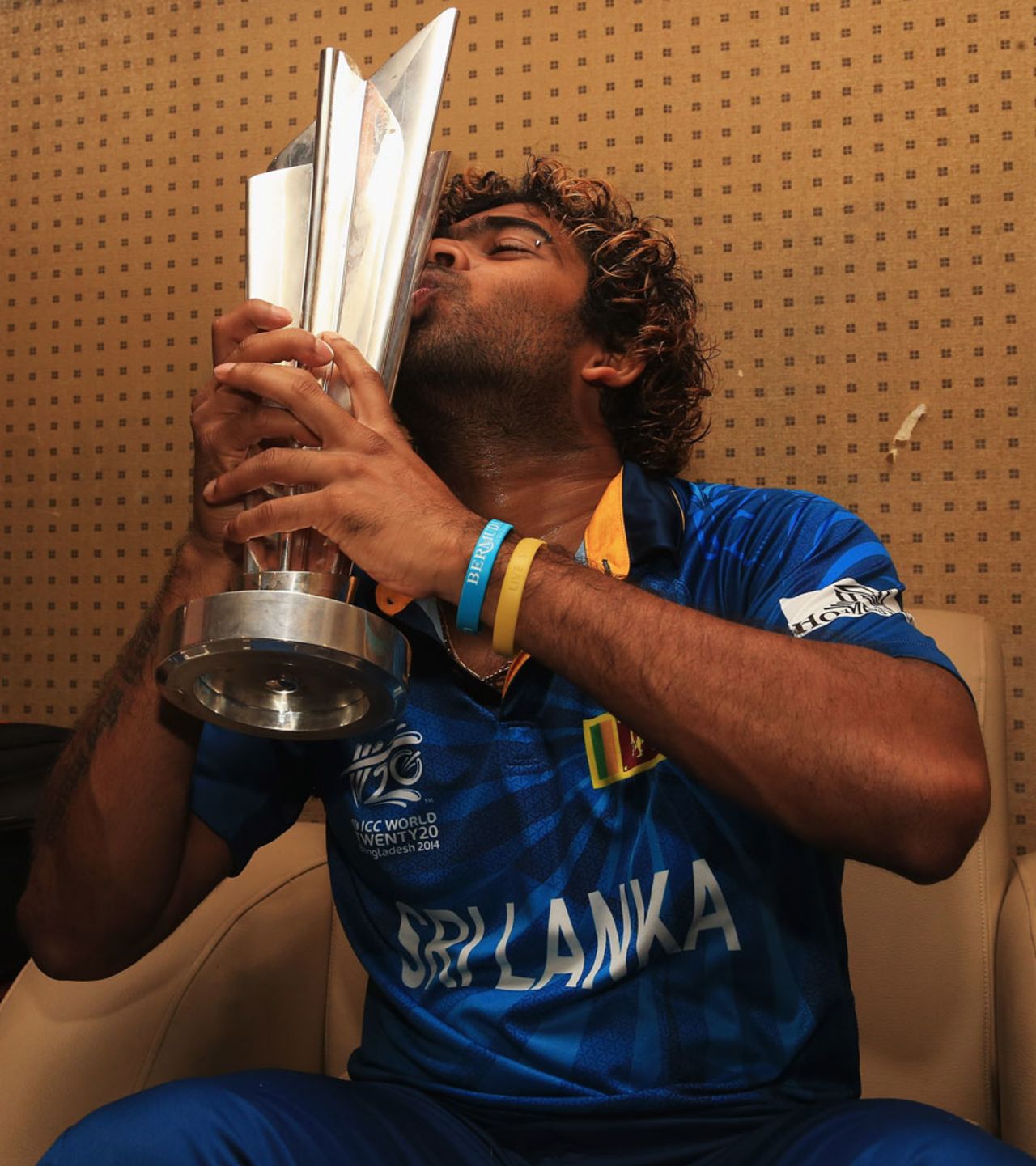 At long last. Lasith Malinga lays his hands on the trophy, India v Sri Lanka, final, World T20, Mirpur, April 6, 2014
