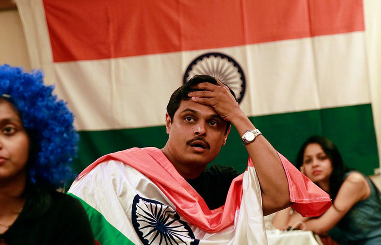 Dejected fans react to India's defeat in the World T20 final, Mumbai, April 6, 2014