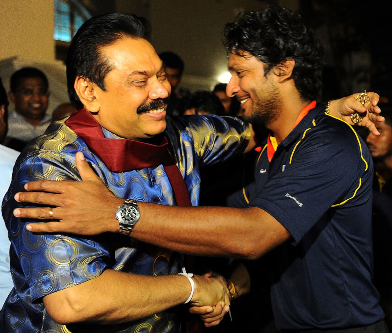 Kumar Sangakkara is hugged by Sri Lanka president Mahinda Rajapakse after the team's World T20 triumph, Colombo, April 8, 2014