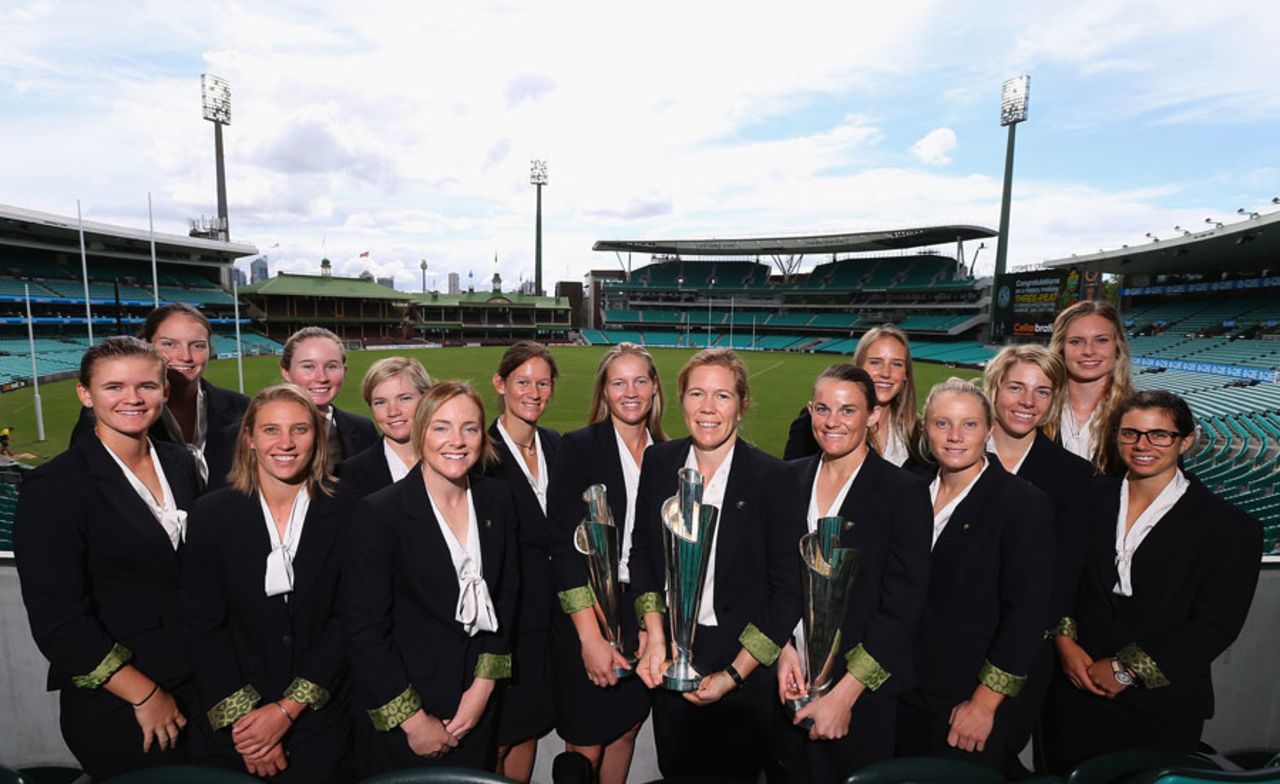 The victorious Australian Women's team pose with the World T20 trophy at the SCG, Sydney, April 9, 2014