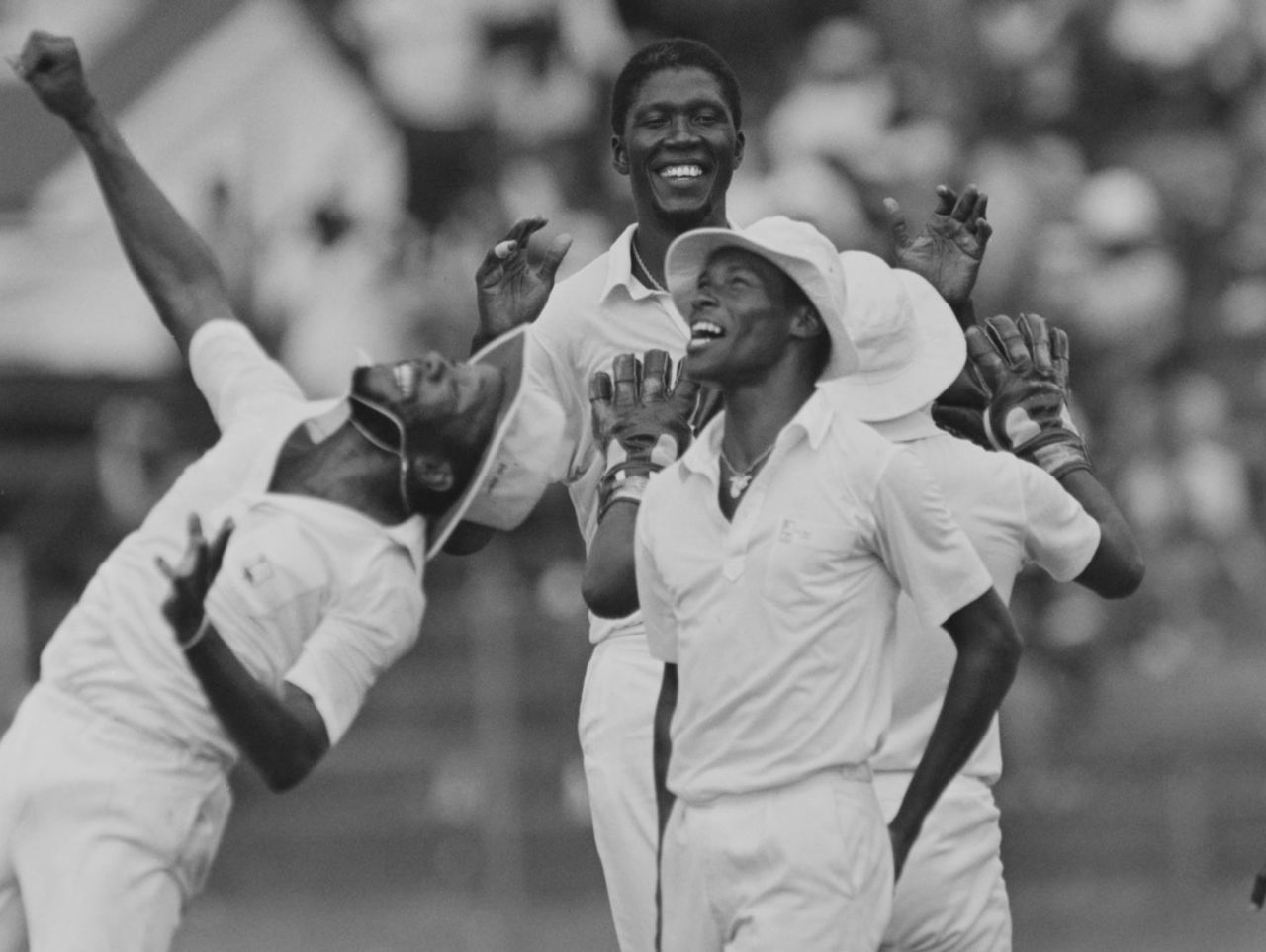 Joel Garner and his team-mates celebrate a wicket, 1986