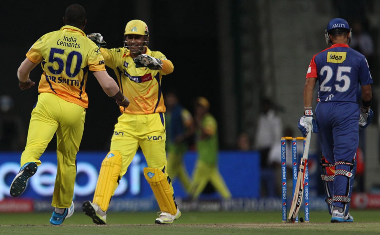 MS Dhoni and Dwayne Smith celebrate the vital wicket of JP Duminy, Chennai Super Kings v Delhi Daredevils, IPL 2014, Abu Dhabi, April 21, 2014