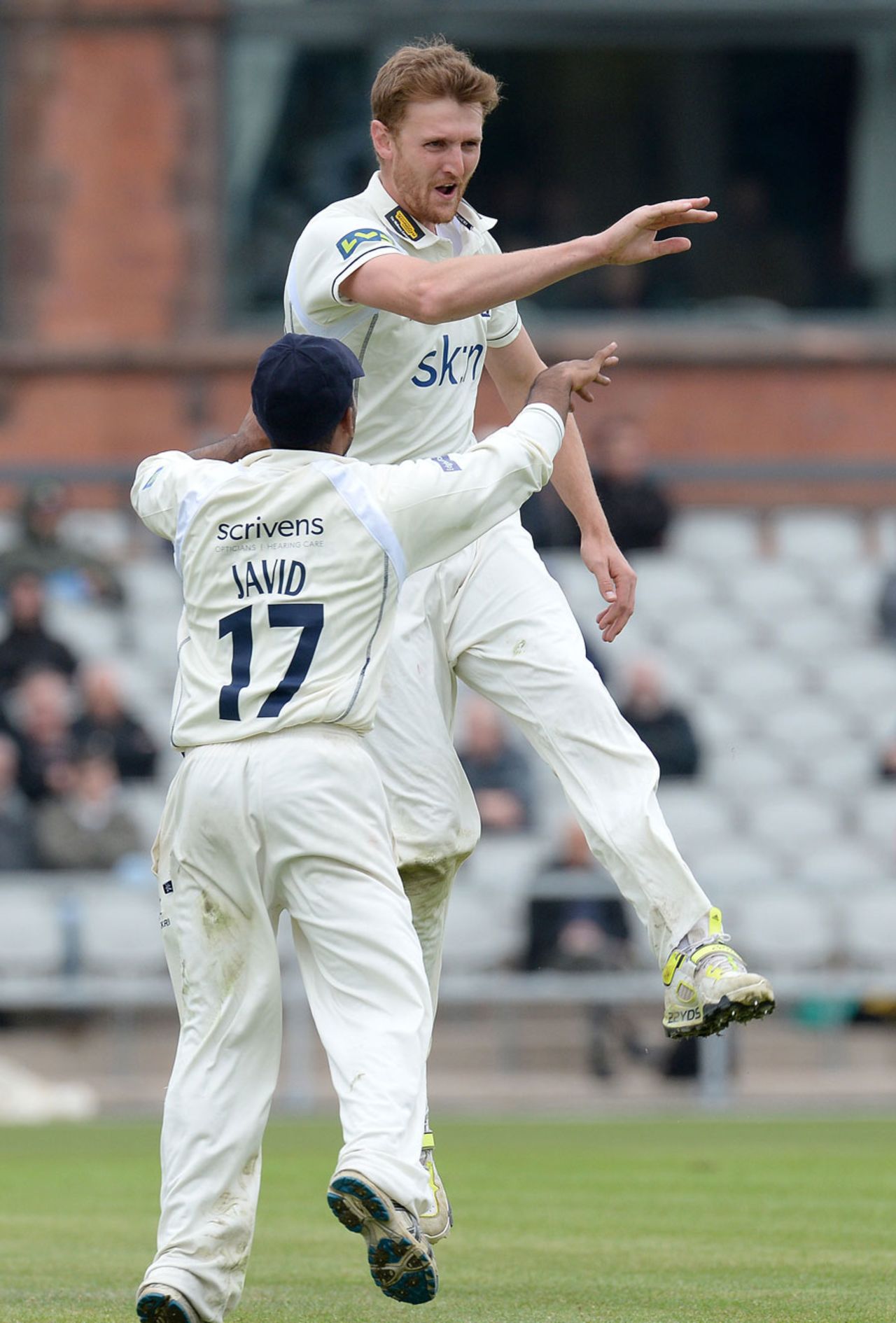 Oliver Hannon-Dalby celebrates one of his two wickets, Lancashire v Warwickshire, County Championship, Division One, Old Trafford, 4th day, April 23, 2014