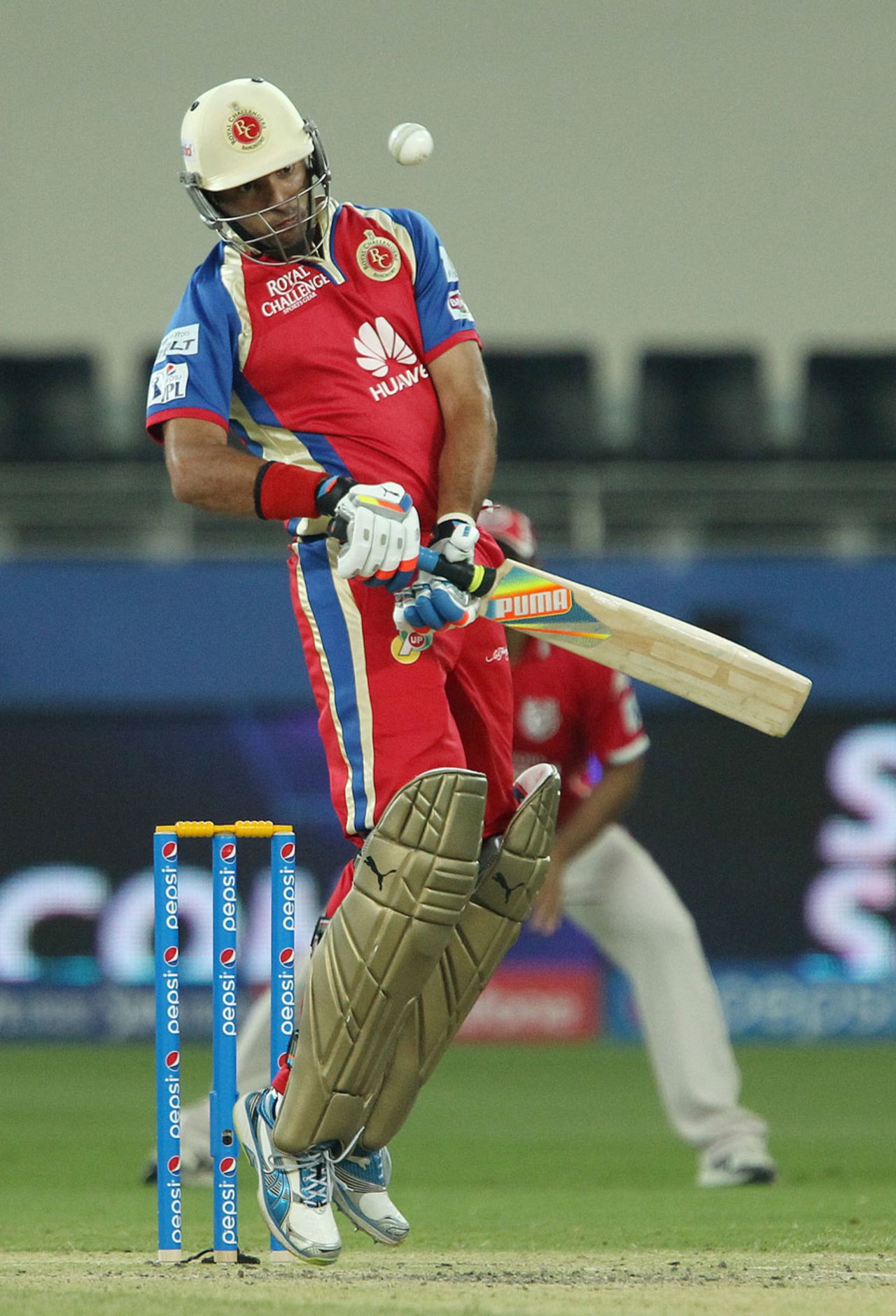 Yuvraj Singh avoids a bouncer from Mitchell Johnson, Kings XI Punjab v Royal Challengers Bangalore, IPL 2014, Dubai, April 28, 2014