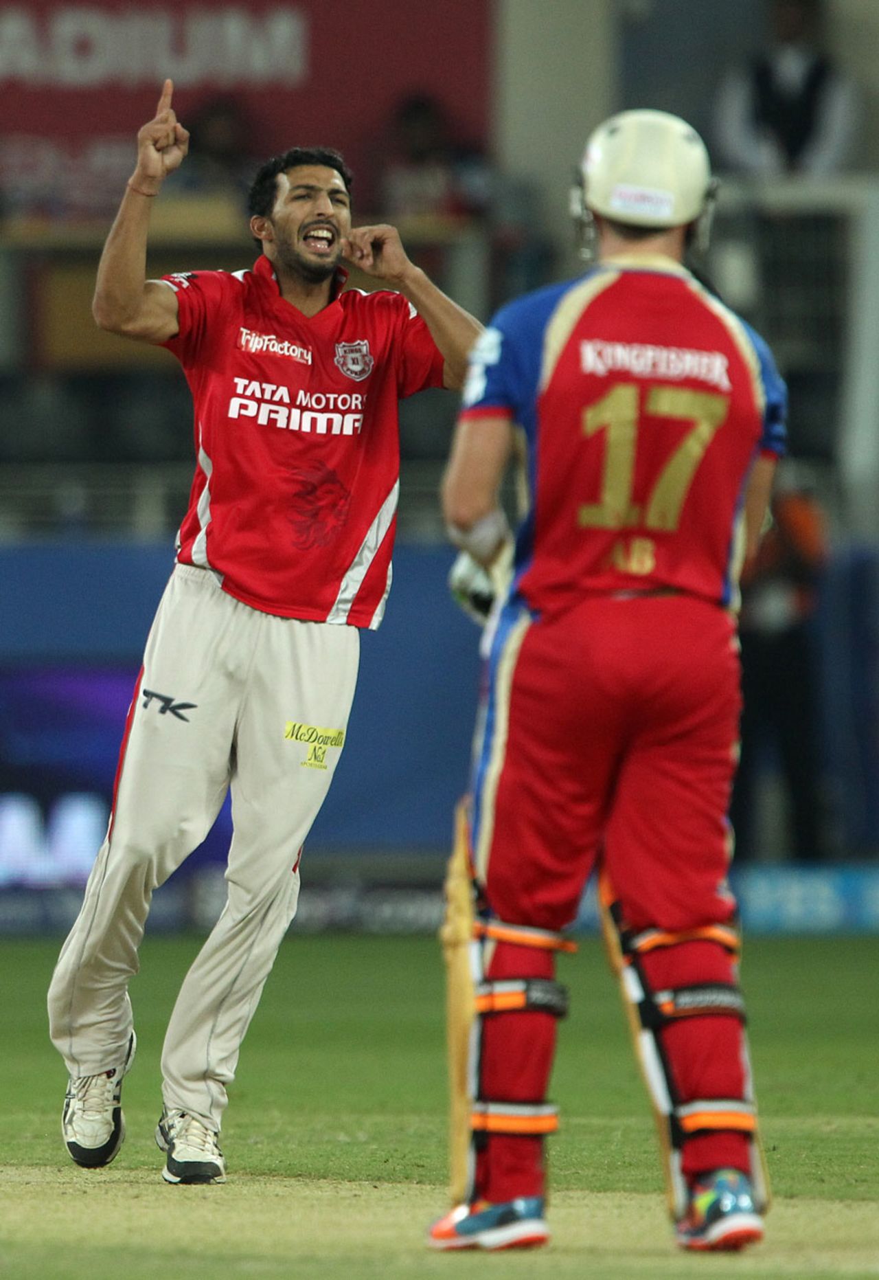 Rishi Dhawan celebrates the wicket of AB de Villiers, Kings XI Punjab v Royal Challengers Bangalore, IPL 2014, Dubai, April 28, 2014