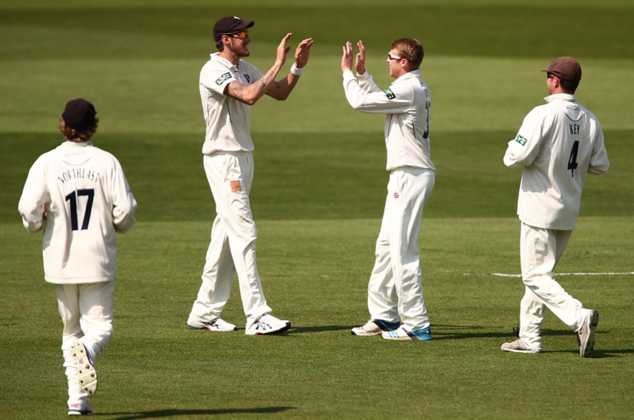 Ben Harmison and Adam Riley high five after combining for a wicket, Kent v Surrey, County Championship, Division Two, Canterbury, 1st day, May 4, 2014