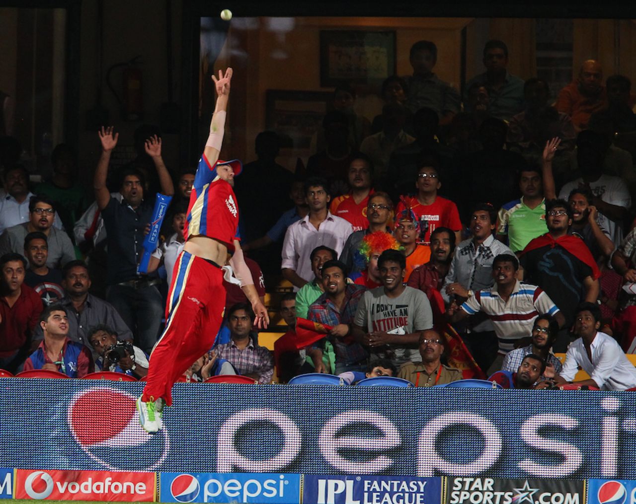 Is that a bird..? Rilee Rossouw leaps, but fails to keep a lofted shot in, Royal Challengers Bangalore v Sunrisers Hyderabad, IPL, Bangalore, May 4, 2014