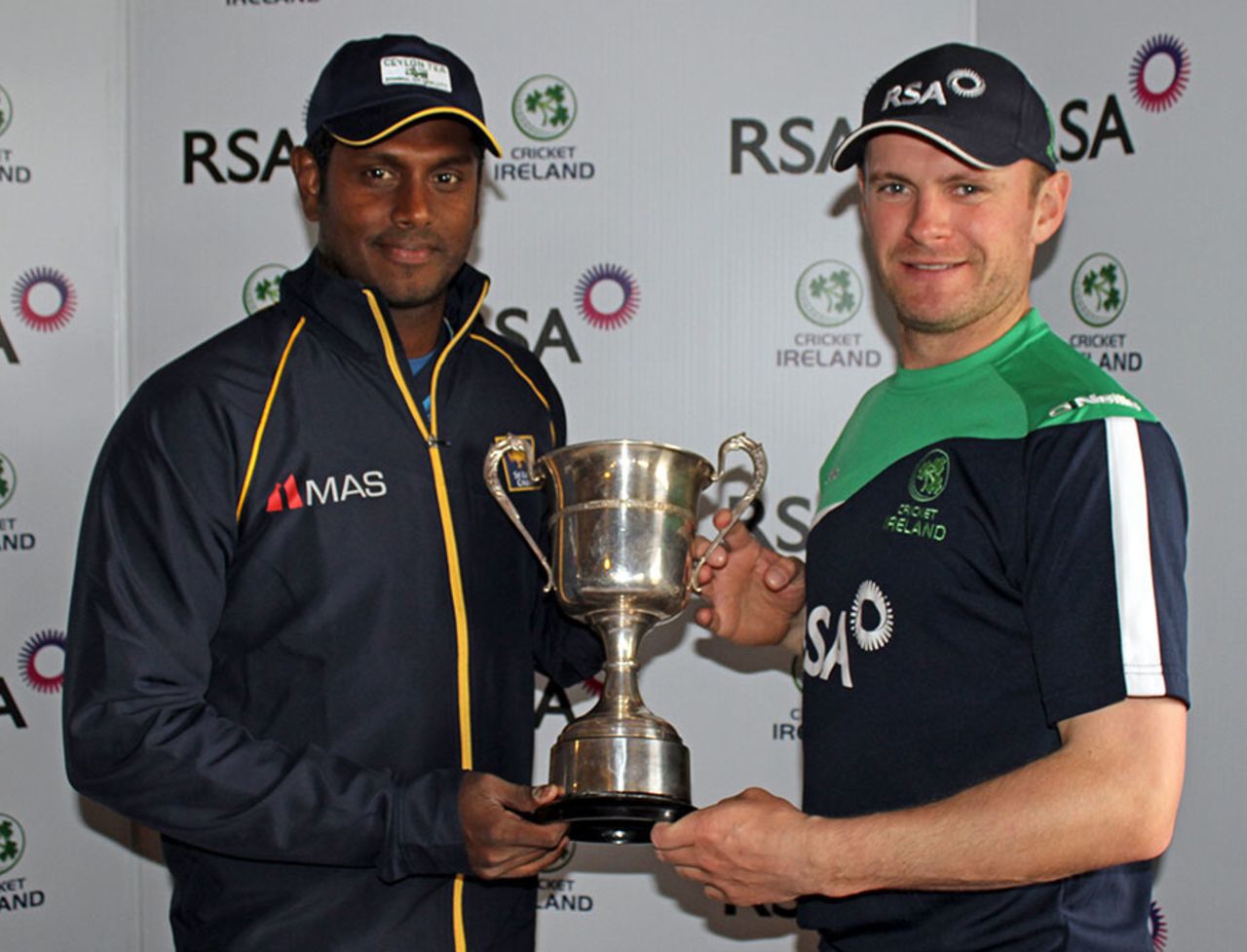 Angelo Mathews and William Porterfield hold up the RSA Insurance ODI Series trophy, Dublin, May 5, 2014