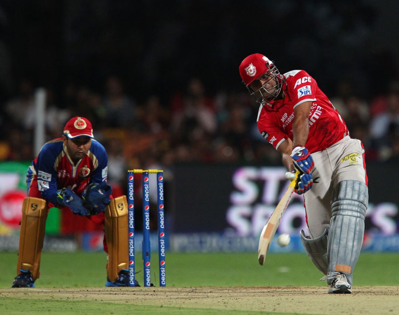 Virender Sehwag tries to launch into a delivery from Yuzvendra Chahal, Royal Challengers Bangalore v Kings XI Punjab, IPL 2014, Bangalore, May 9, 2014