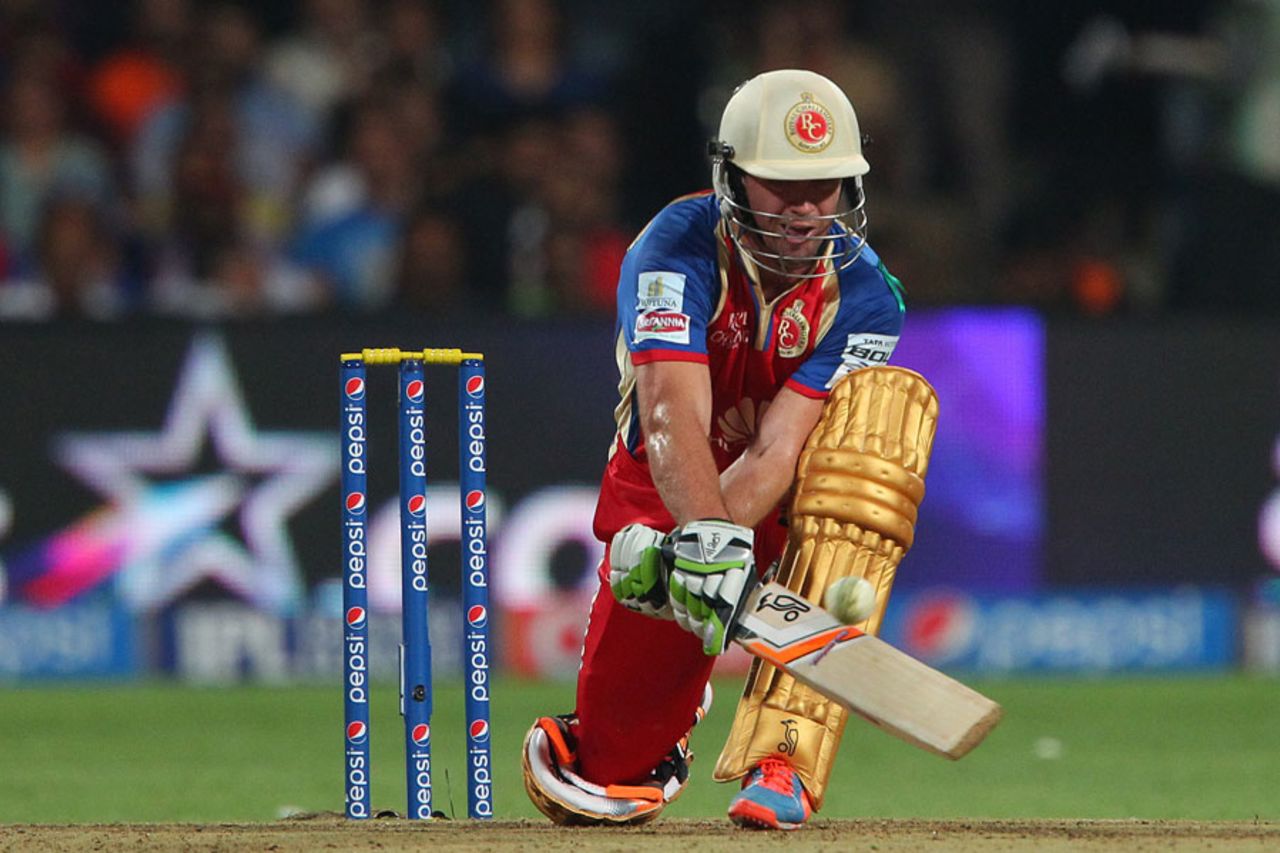 AB de Villiers reverse sweeps on the way to his 32-ball 58, Royal Challengers Bangalore v Rajasthan Royals, IPL 2014, Bangalore, May 11, 2014