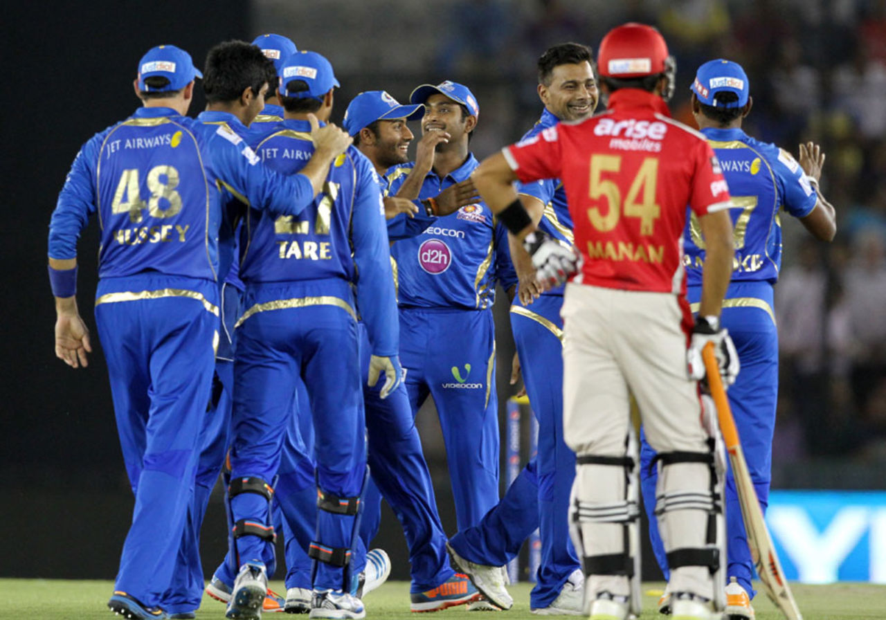 Praveen Kumar is congratulated after getting Virender Sehwag run-out, Kings XI Punjab v Mumbai Indians, IPL 2014, Mohali, May 21, 2014