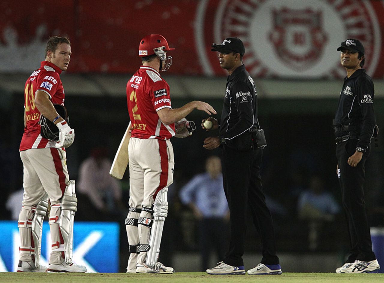 George Bailey has a discussion with the umpires over a bye call off last ball of the innings, Kings XI Punjab v Rajasthan Royals, IPL 2014, Mohali, May 23, 2014