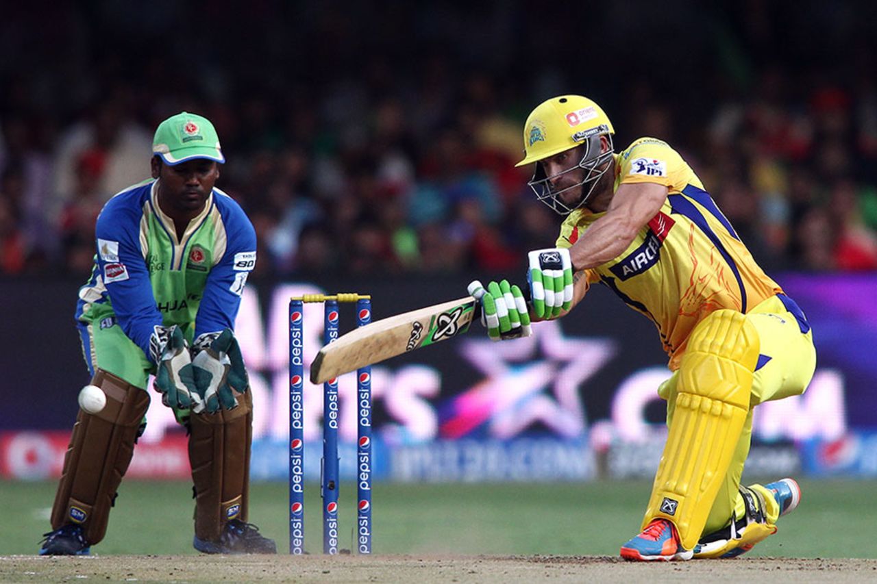 Faf du Plessis gives himself room and slaps the ball through the off side, Royal Challengers Bangalore v Chennai Super Kings, IPL 2014, Bangalore, May 24, 2014
