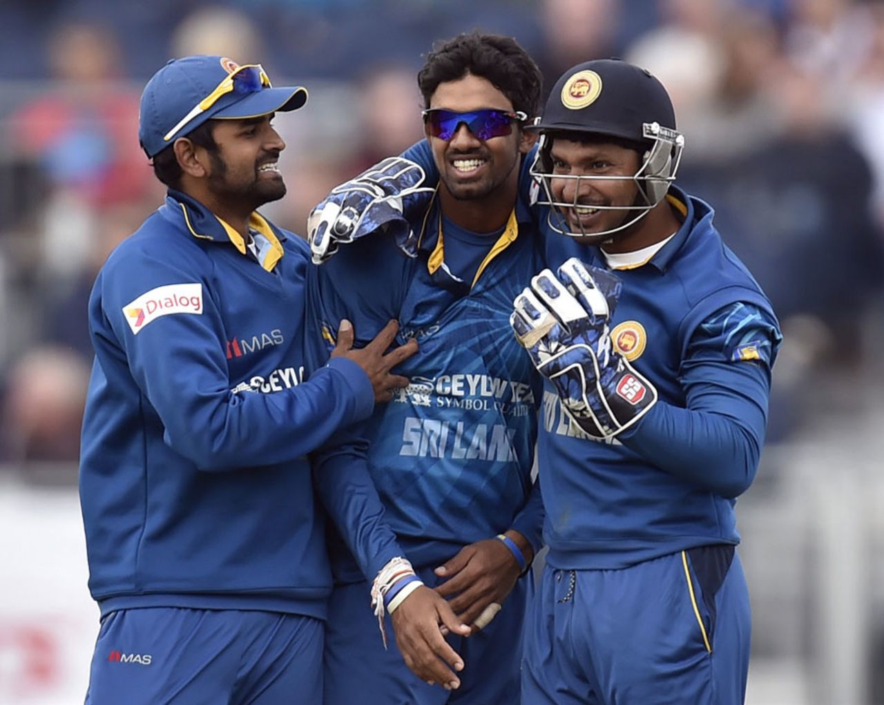 Lahiru Thirimanne and Kumar Sangakkara congratulate Sachithra Senanayake, England v Sri Lanka, 2nd ODI, Chester-le-Street, May 25, 2014