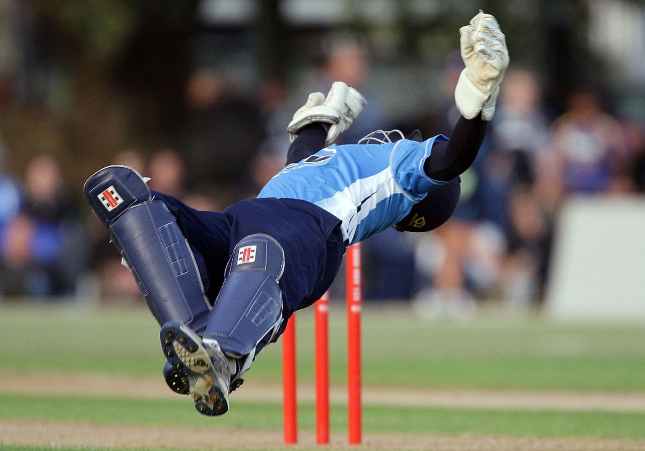 Reece Young dives backwards to take a catch to dismiss Anton Devcich, Auckland v Northern Districts, HRV Cup, Auckland, January 22, 2010