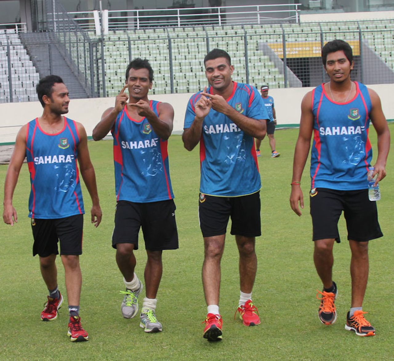 Rubel Hossain and Ziaur Rahman gesture during team training, Dhaka, May 26, 2014