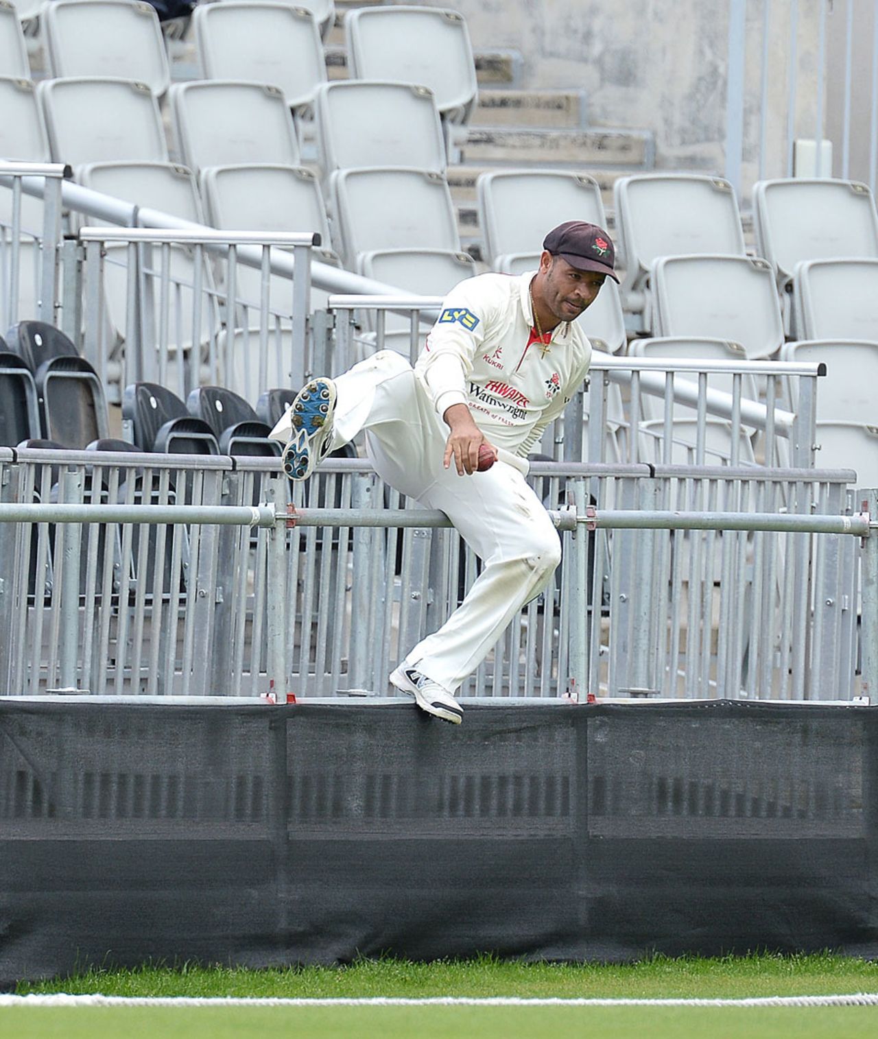 Ashwell Prince had to do some clambering to retrieve the ball, Lancashire v Somerset, County Championship, Division One, Old Trafford, June 2, 2014