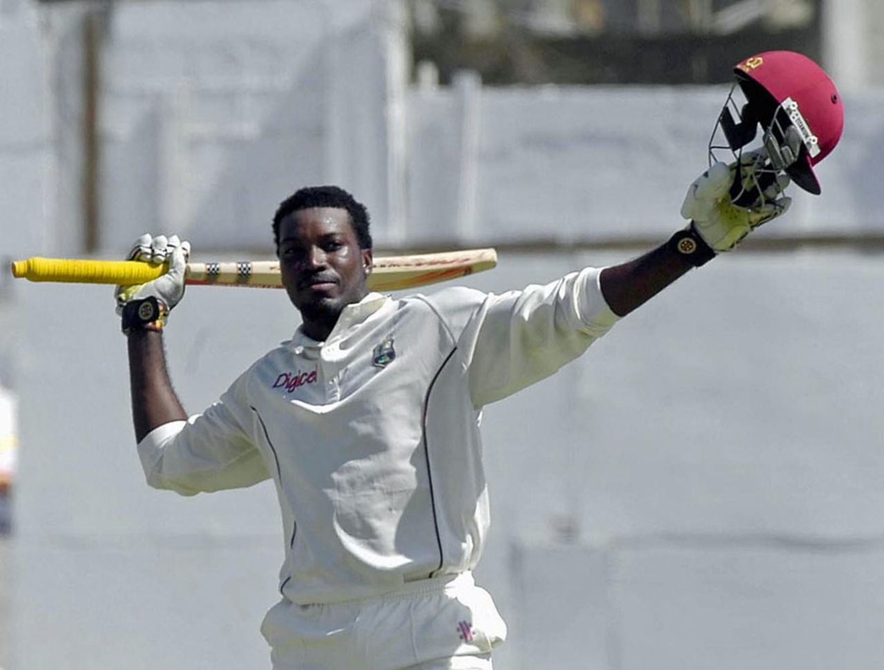 Chris Gayle raises his bat after scoring a hundred, West Indies v South Africa, 4th Test, 4th day, St John's Antigua, May 2, 2005