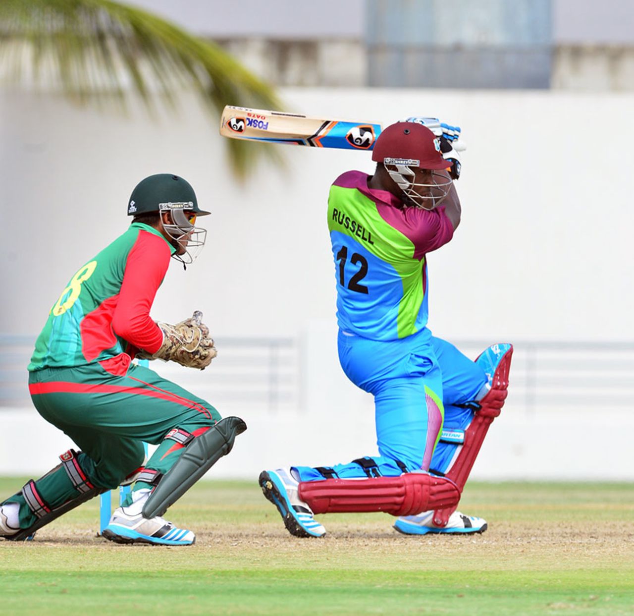 Andre Russell drives through the off side, Sagicor HPC v Bangladesh A, 1st T20, Barbados, June 14, 2014