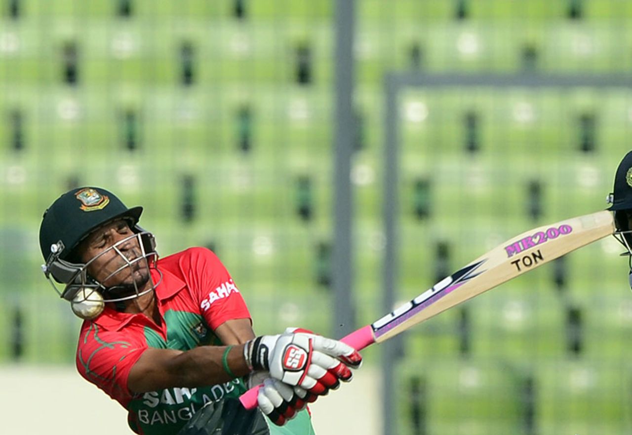 Nasir Hossain is hit on his helmet after missing a sweep, Bangladesh v India, 1st ODI, Mirpur, June 15, 2014