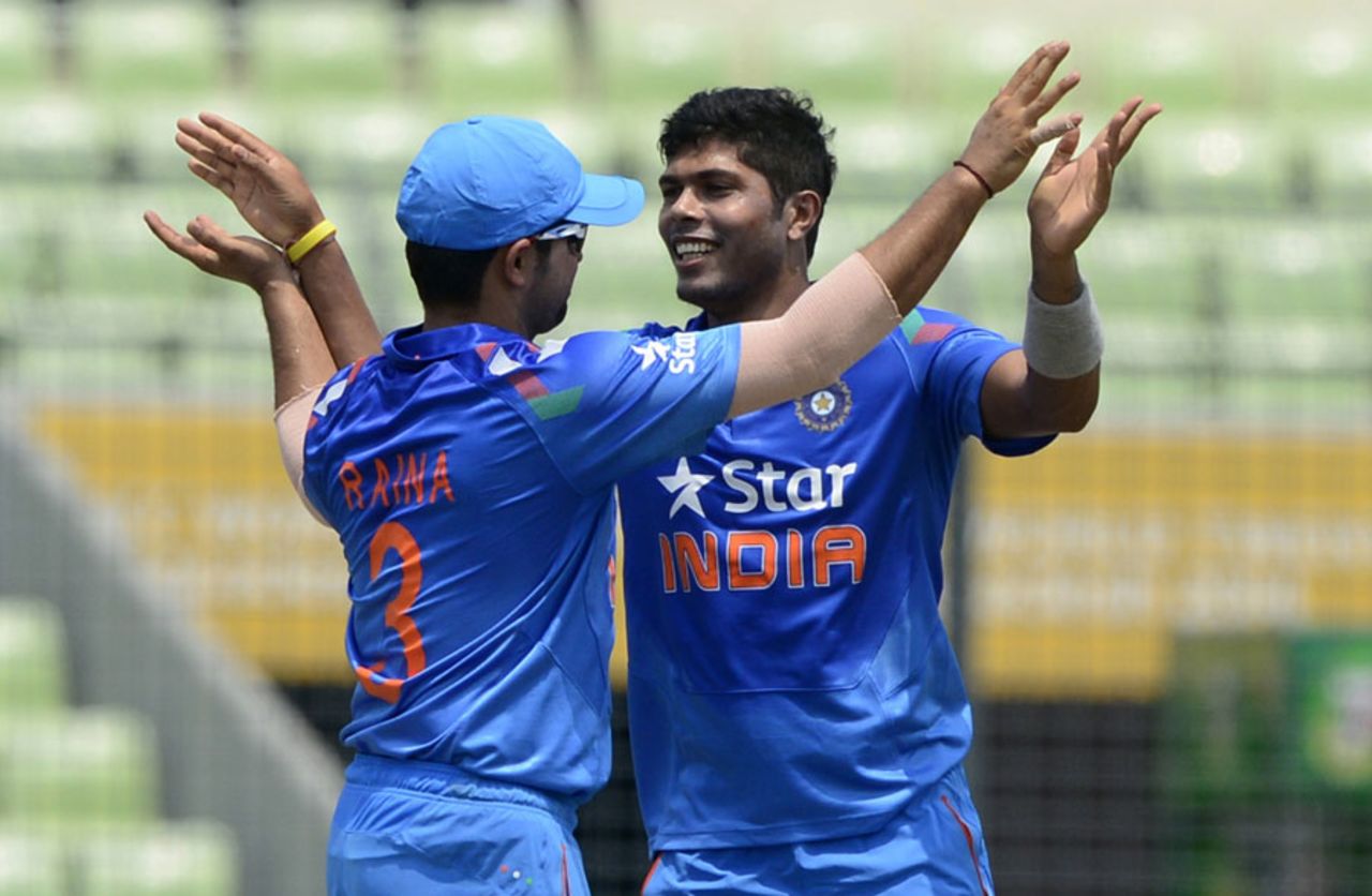 Umesh Yadav is congratulated after a wicket, Bangladesh v India, 1st ODI, Mirpur, June 15, 2014