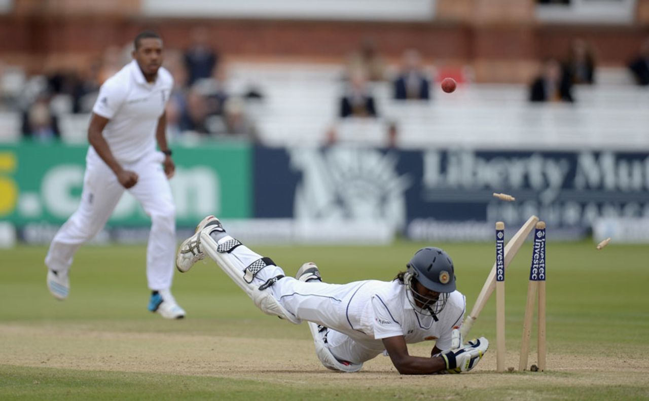 Nuwan Pradeep crashes into his stumps after avoiding a short ball, England v Sri Lanka, 1st Investec Test, Lord's, 4th day, June 15, 2014