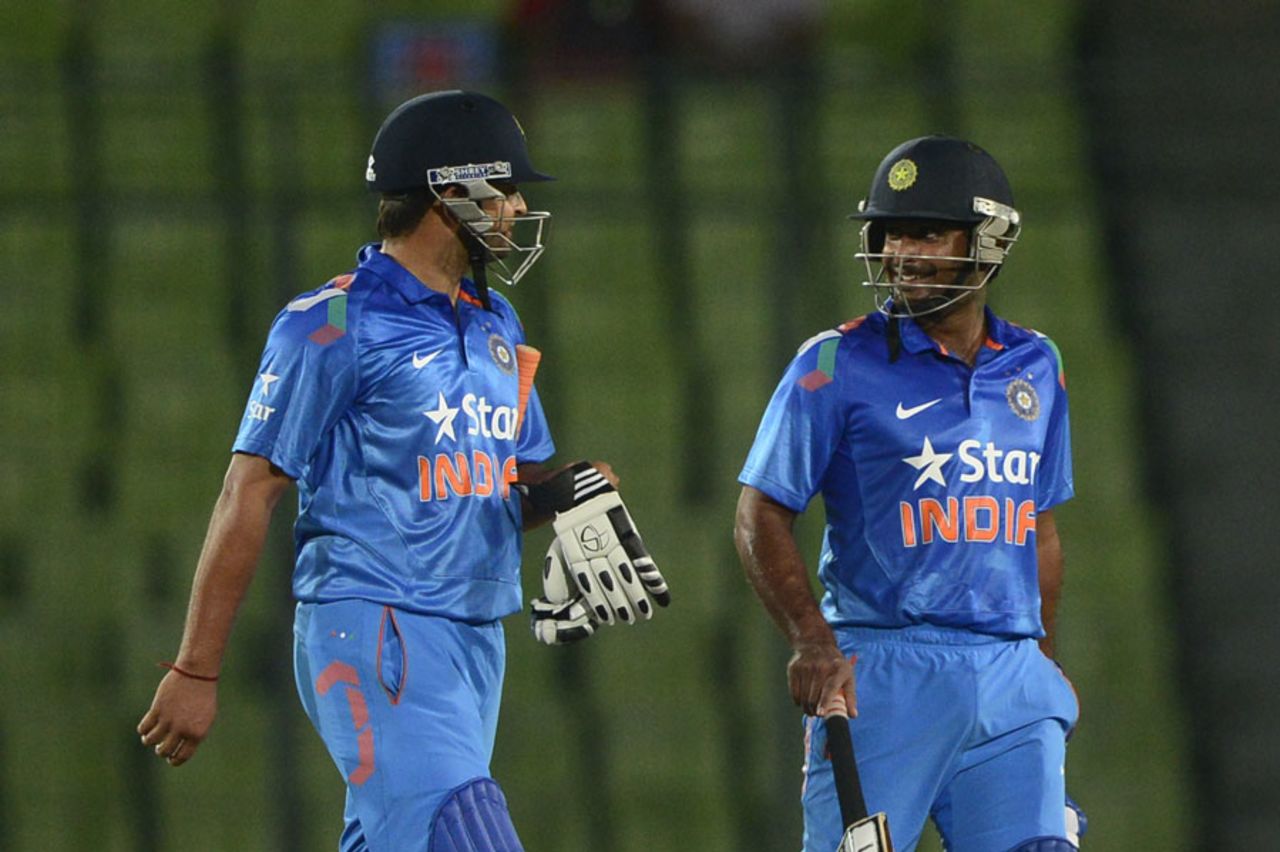 Suresh Raina and Ambati Rayudu walk off the field after India's win, Bangladesh v India, 1st ODI, Mirpur, June 15, 2014