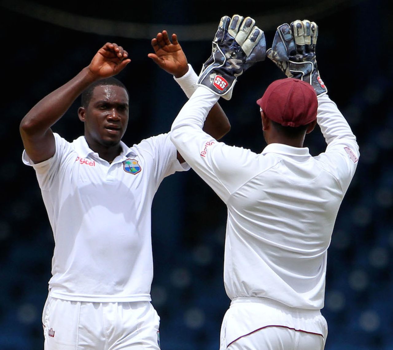 Jerome Taylor is congratulated by Denesh Ramdin after picking up a wicket, West Indies v New Zealand, 2nd Test, Trinidad, 1st day, June 16, 2014