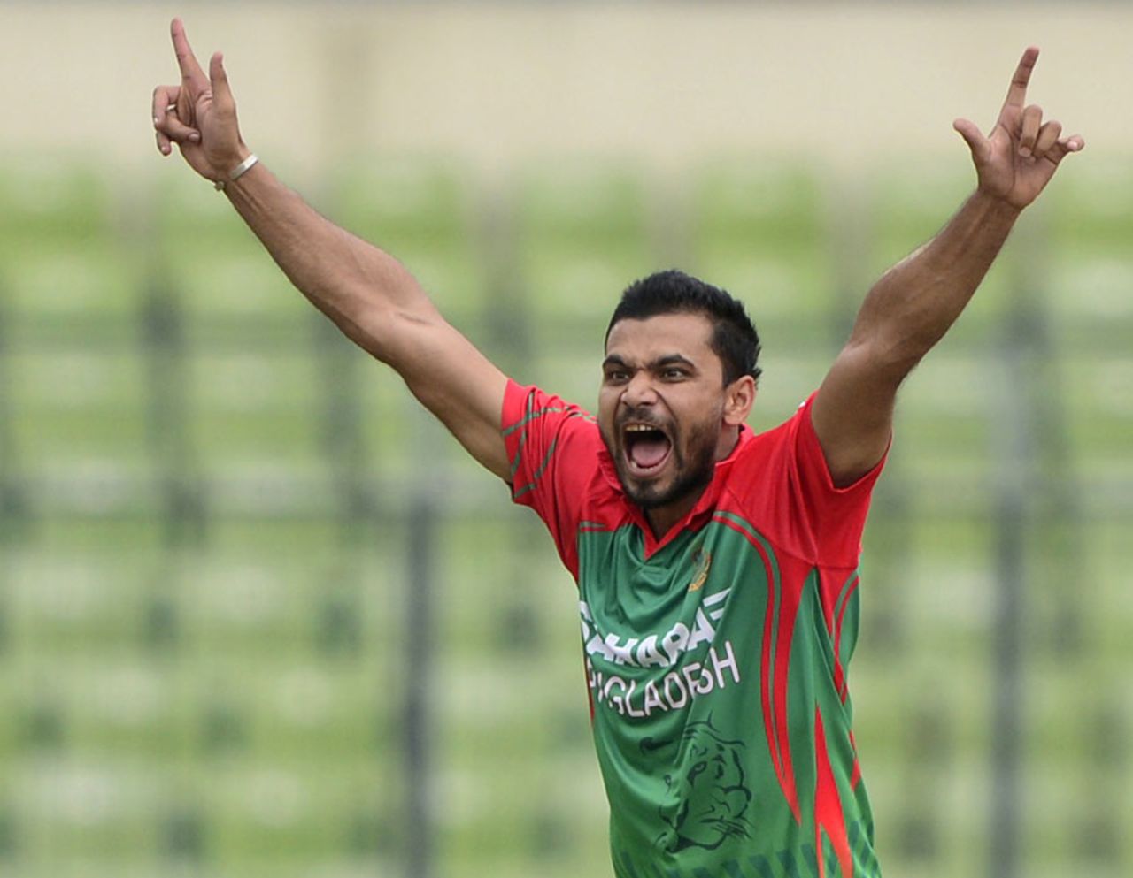 Mashrafe Mortaza celebrates the wicket of Ajinkya Rahane, Bangladesh v India, 2nd ODI, Mirpur, June 17, 2014