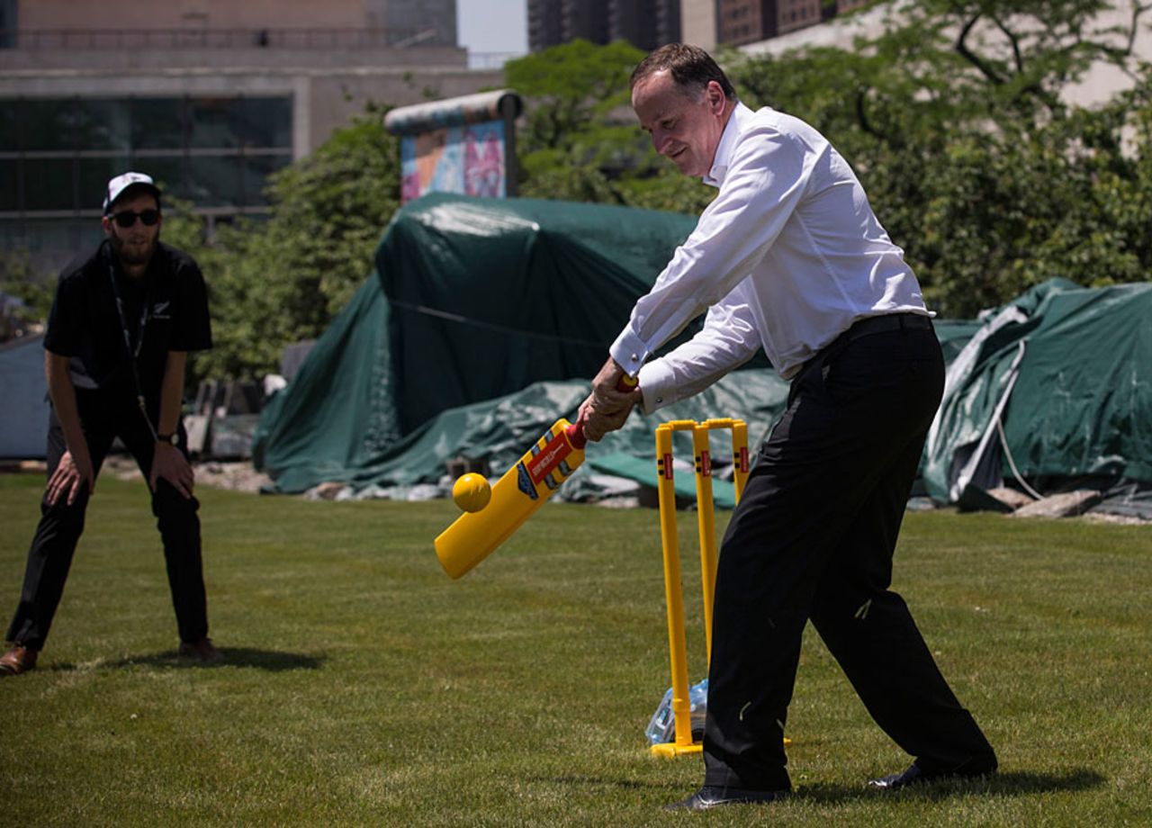John Key, the New Zealand Prime Minister, plays cricket at an event in New York to promote the 2015 World Cup, New York, June 18, 2014