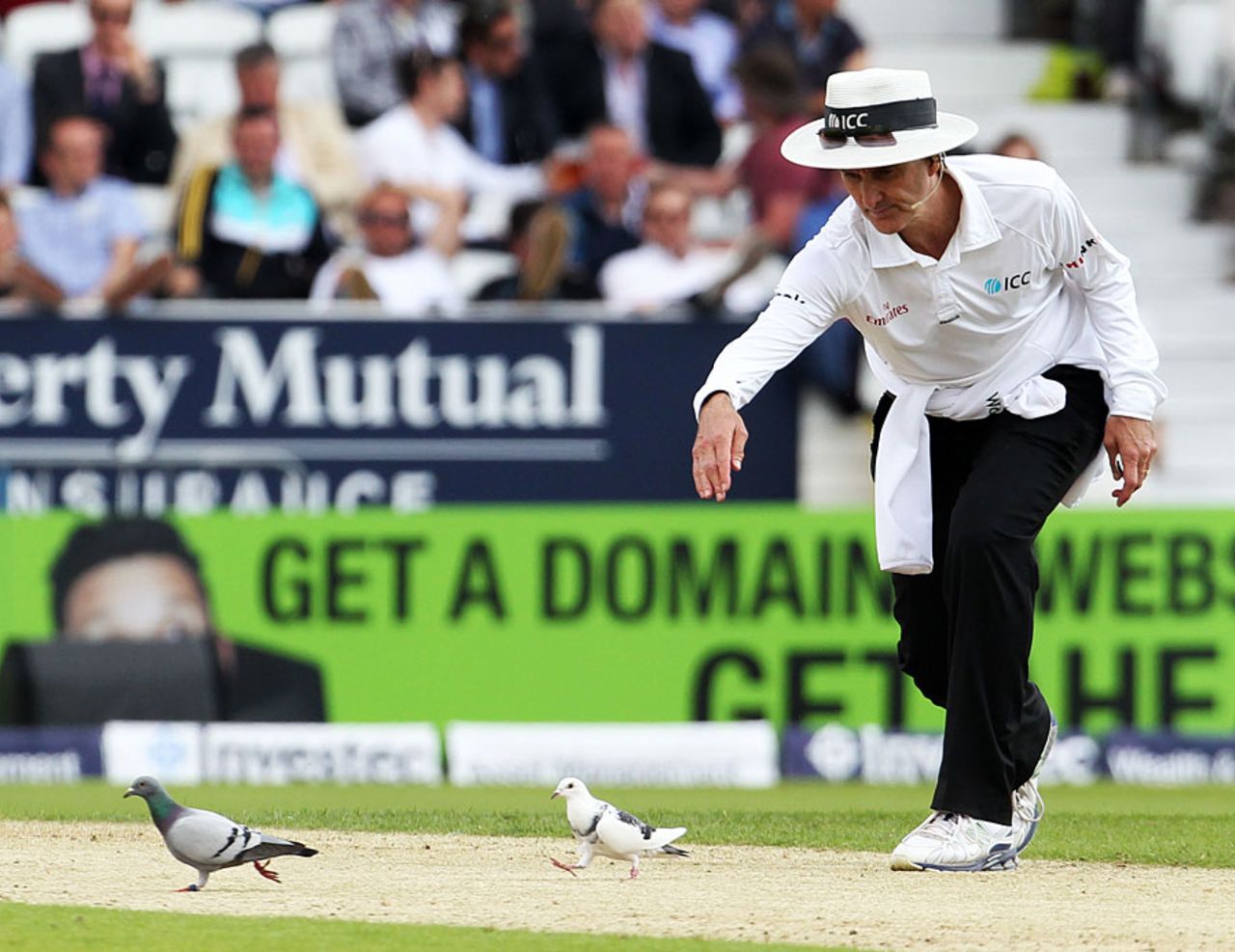 Billy Bowden tries to shoo away some guests, England v Sri Lanka, 2nd Investec Test, Headingley, 1st day, June 20, 2014