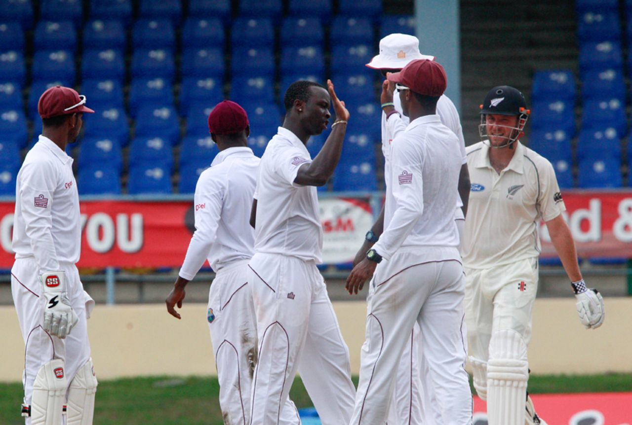 Kemar Roach gets together with team-mates after dismissing Mark Craig, West Indies v New Zealand, 2nd Test, Trinidad, 5th day, June 20, 2014