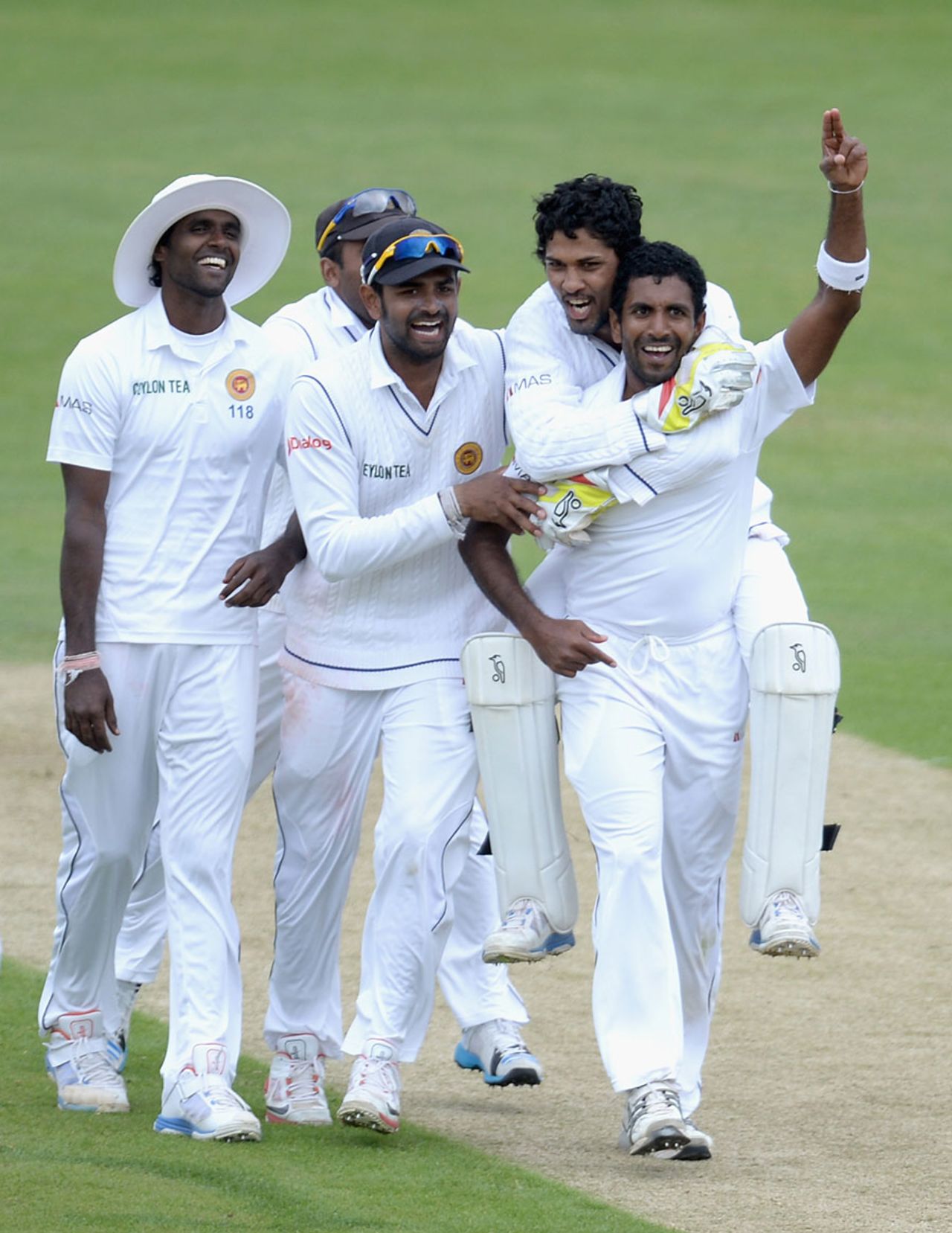 Dhammika Prasad is mobbed after his fifth wicket, England v Sri Lanka, 2nd Investec Test, Headingley, 5th day, June 24, 2014