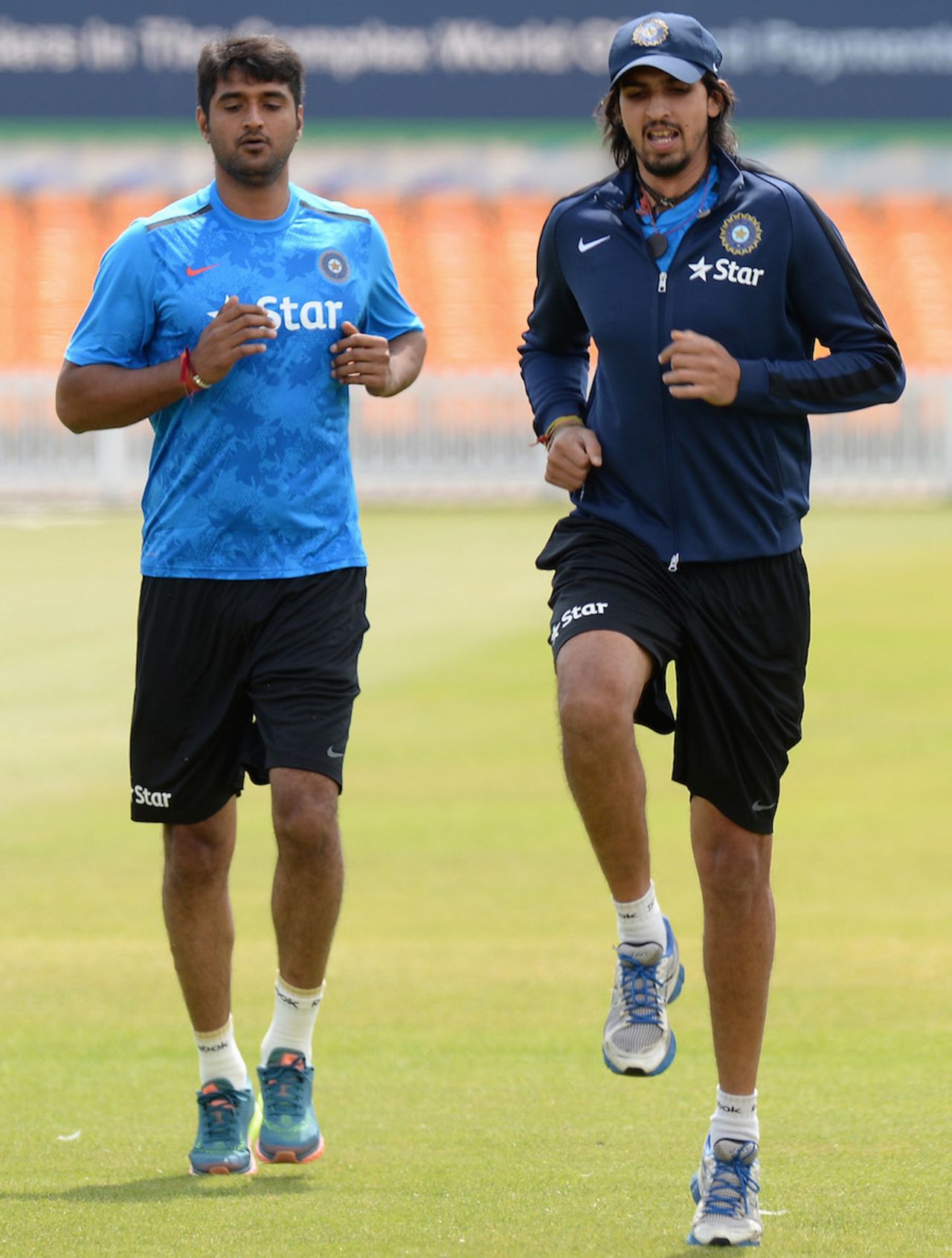 Ishant Sharma and Pankaj Singh jog during a training session, Leicester, June 25, 2014 