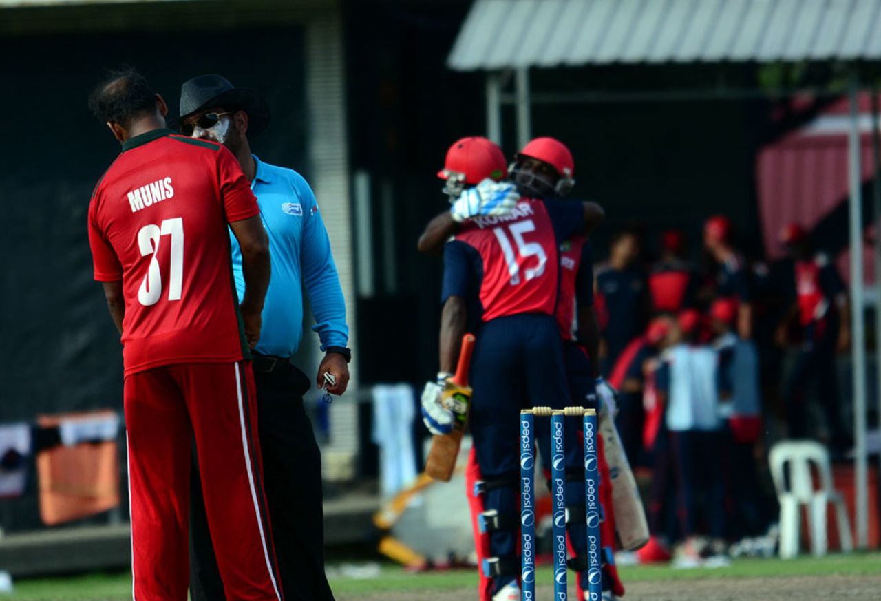The Singapore players celebrate their win, Singapore v Jersey, ICC World Cricket League Division 4, Singapore, June 27, 2014