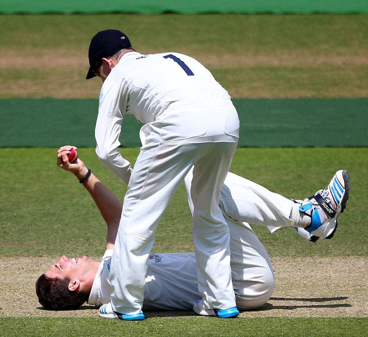 Putting his back into it: Steven Finn claimed a catch off his own bowling, Middlesex v Northamptonshire, County Championship, Division One, Lord's, 3rd day, July 1, 2014