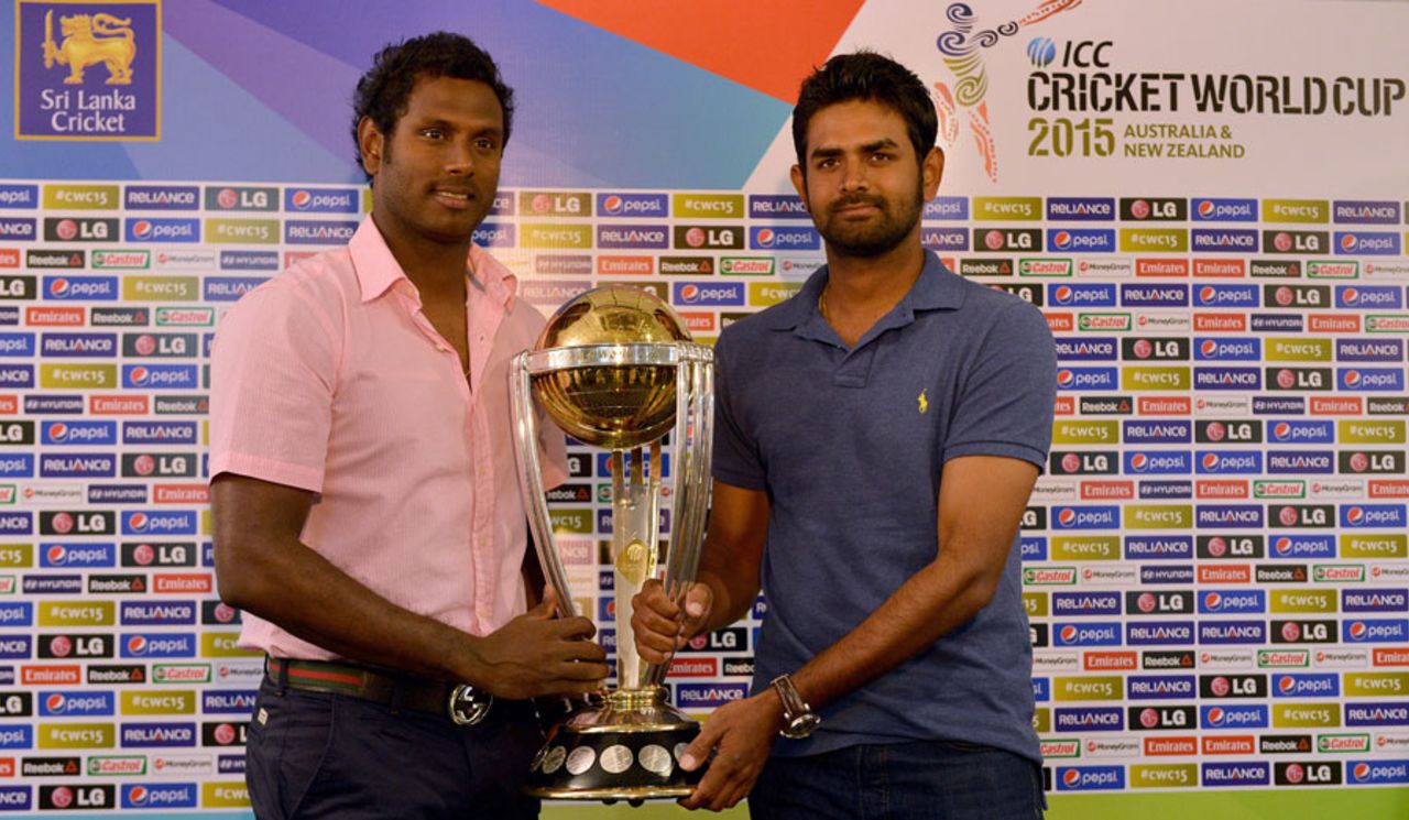 Angelo Mathews and Lahiru Thirimanne pose with the World Cup trophy, Colombo, July 4, 2014