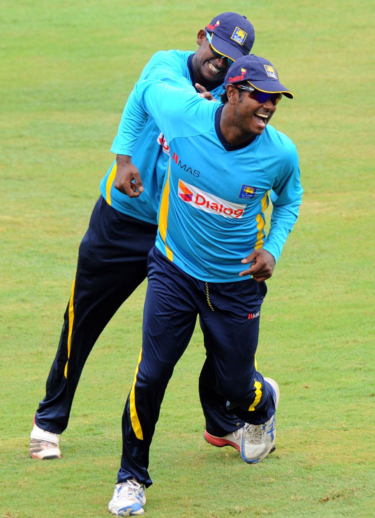 Ajantha Mendis and Angelo Mathews have fun during training, Colombo, July 5, 2014
