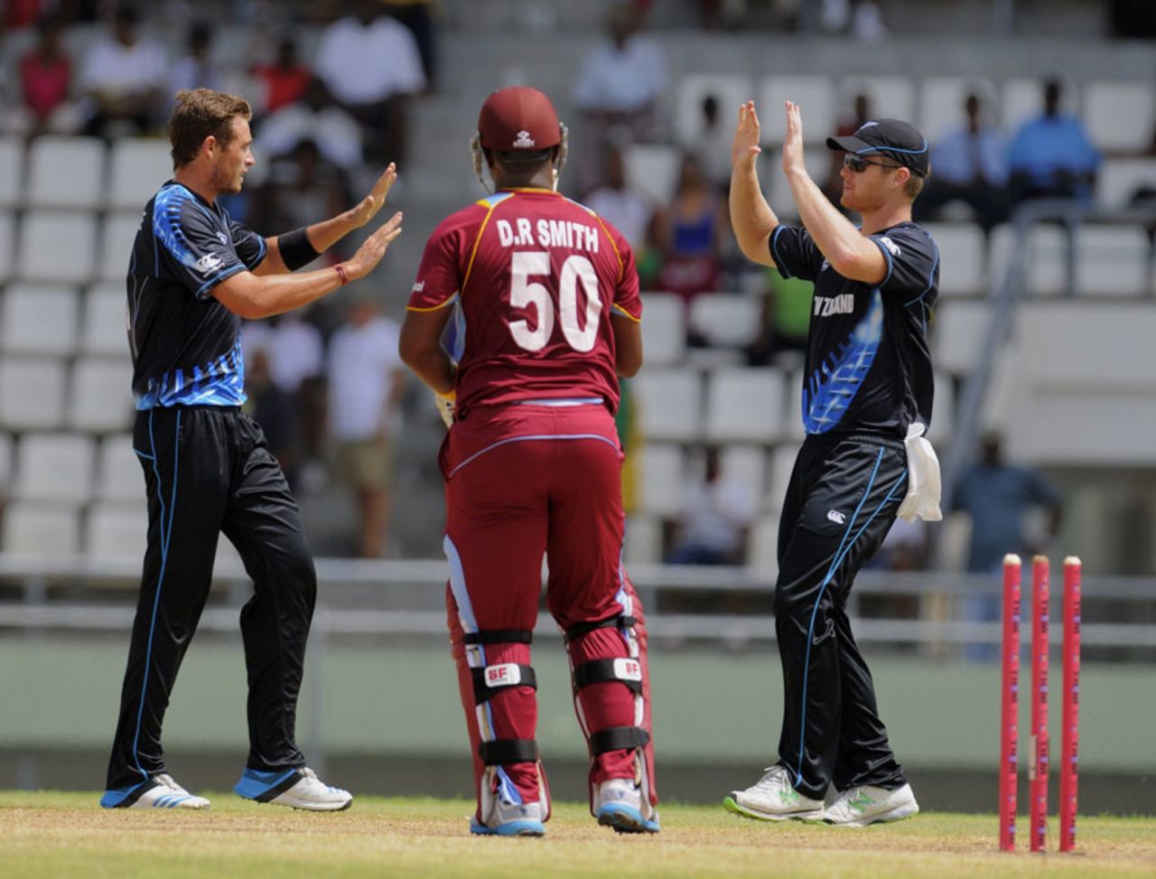 Tim Southee and Corey Anderson celebrate a wicket, West Indies v New Zealand, 2nd T20I, Dominica, July 6, 2014
