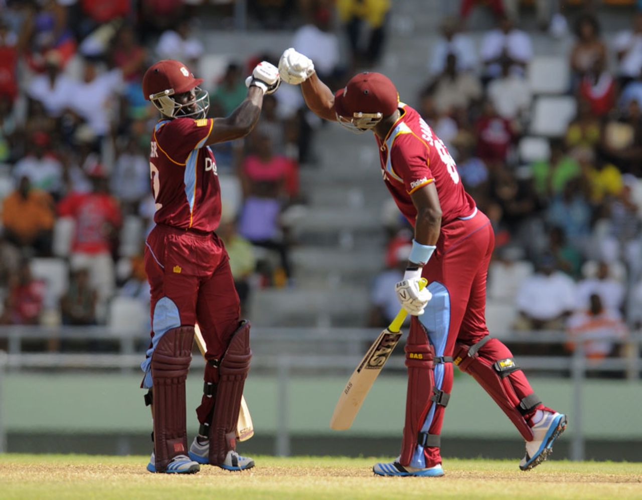 Andre Fletcher and Darren Sammy punch gloves, West Indies v New Zealand, 2nd T20I, Dominica, July 6, 2014