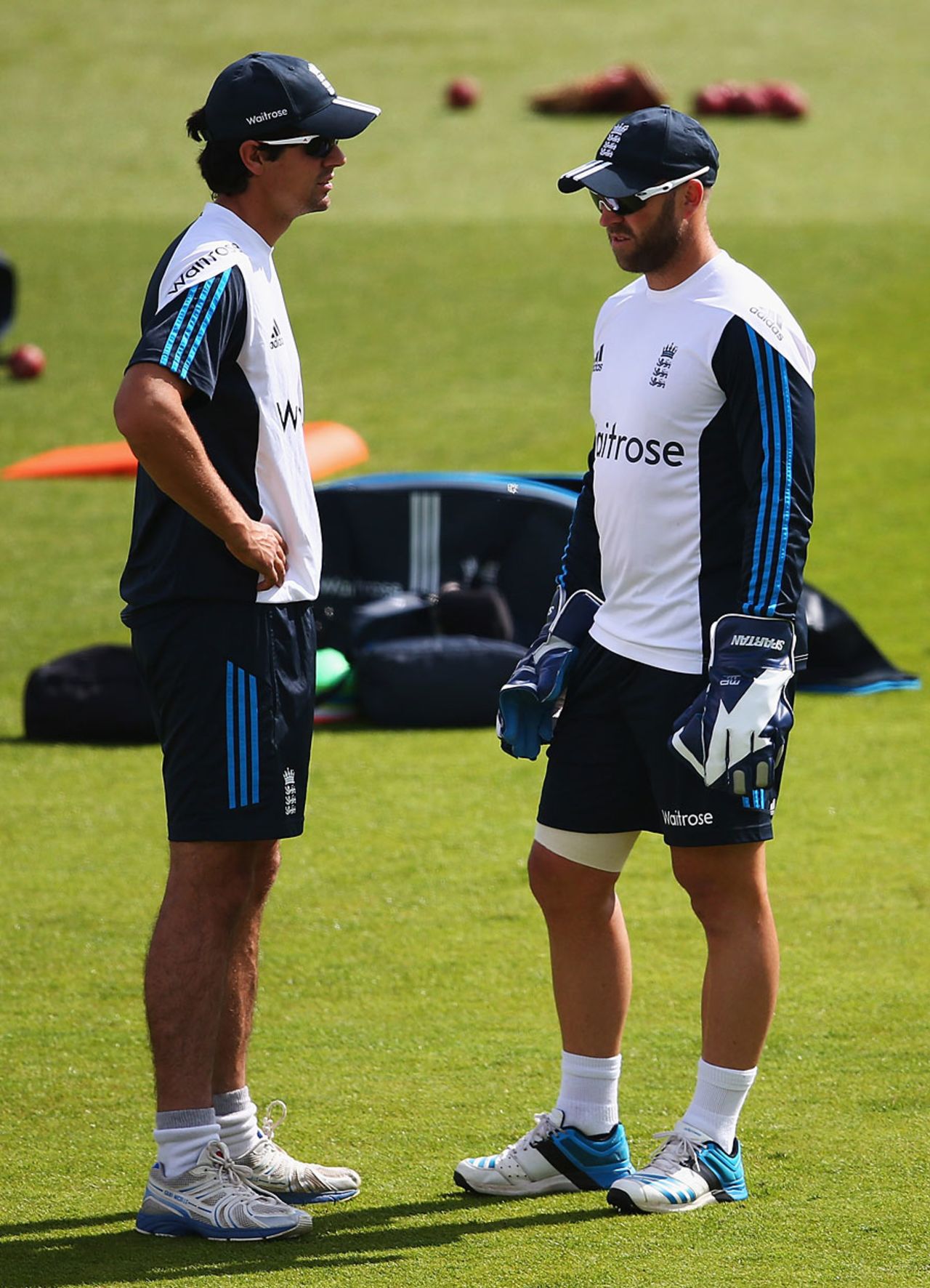 Matt Prior, with his thigh strapped, chats with Alastair Cook, Trent Bridge, July 8, 2014