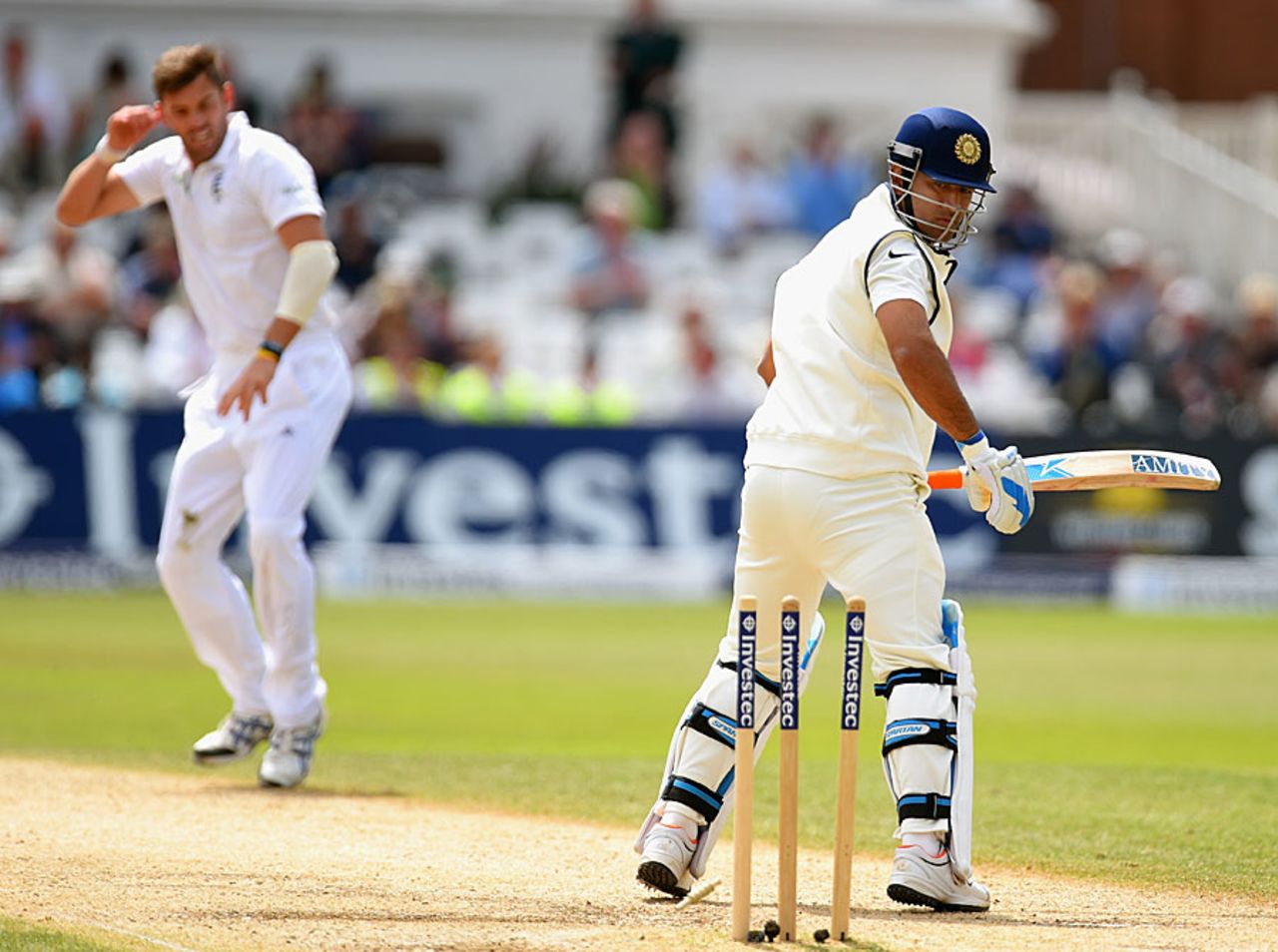 MS Dhoni looks back at his stumps after he was bowled by Liam Plunkett, England v India, 1st Investec Test, Trent Bridge, 5th day, July 13, 2014