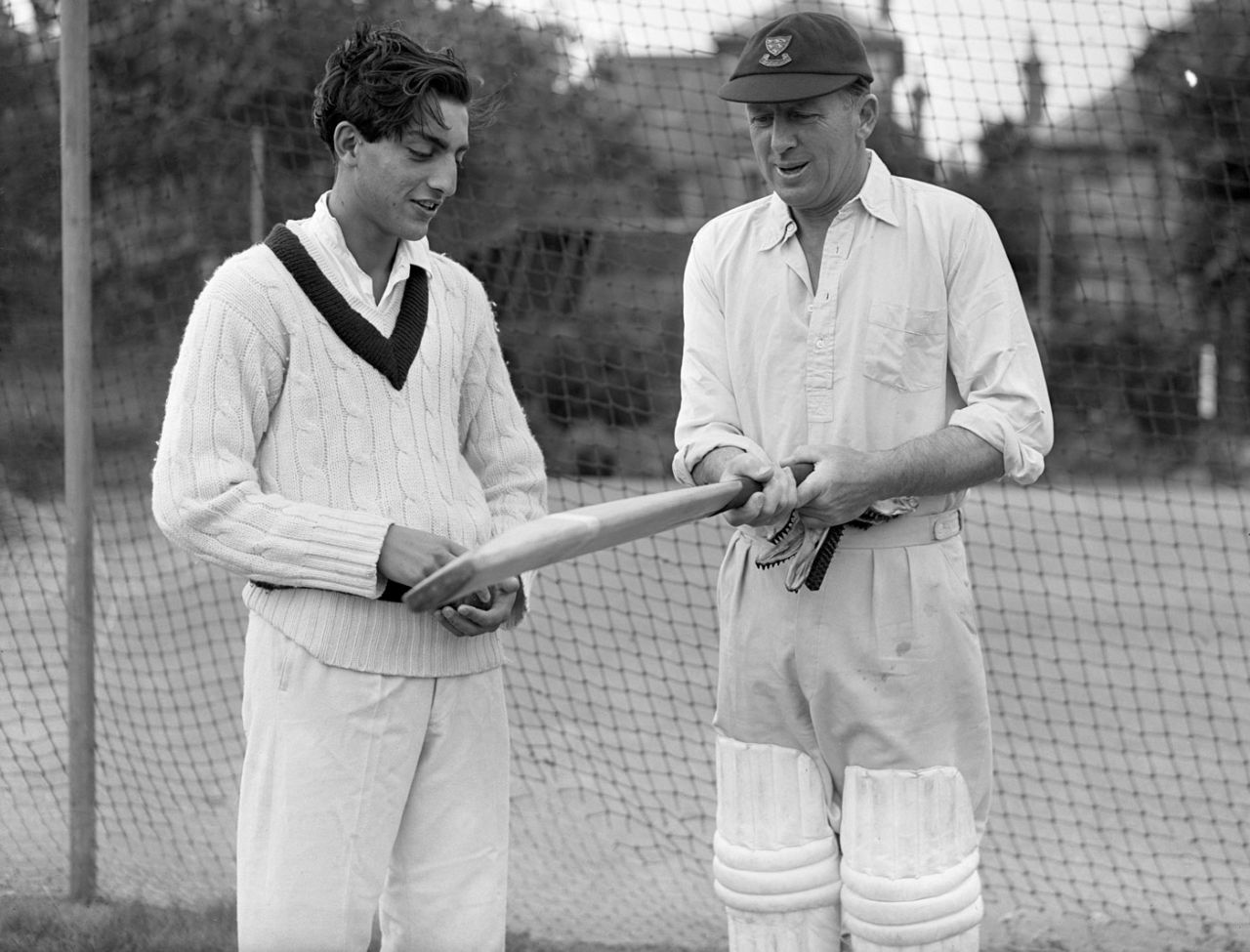 The Nawab of Patudi jr discusses a bat with former Sussex batsman George Cox, Hove, August 14, 1957