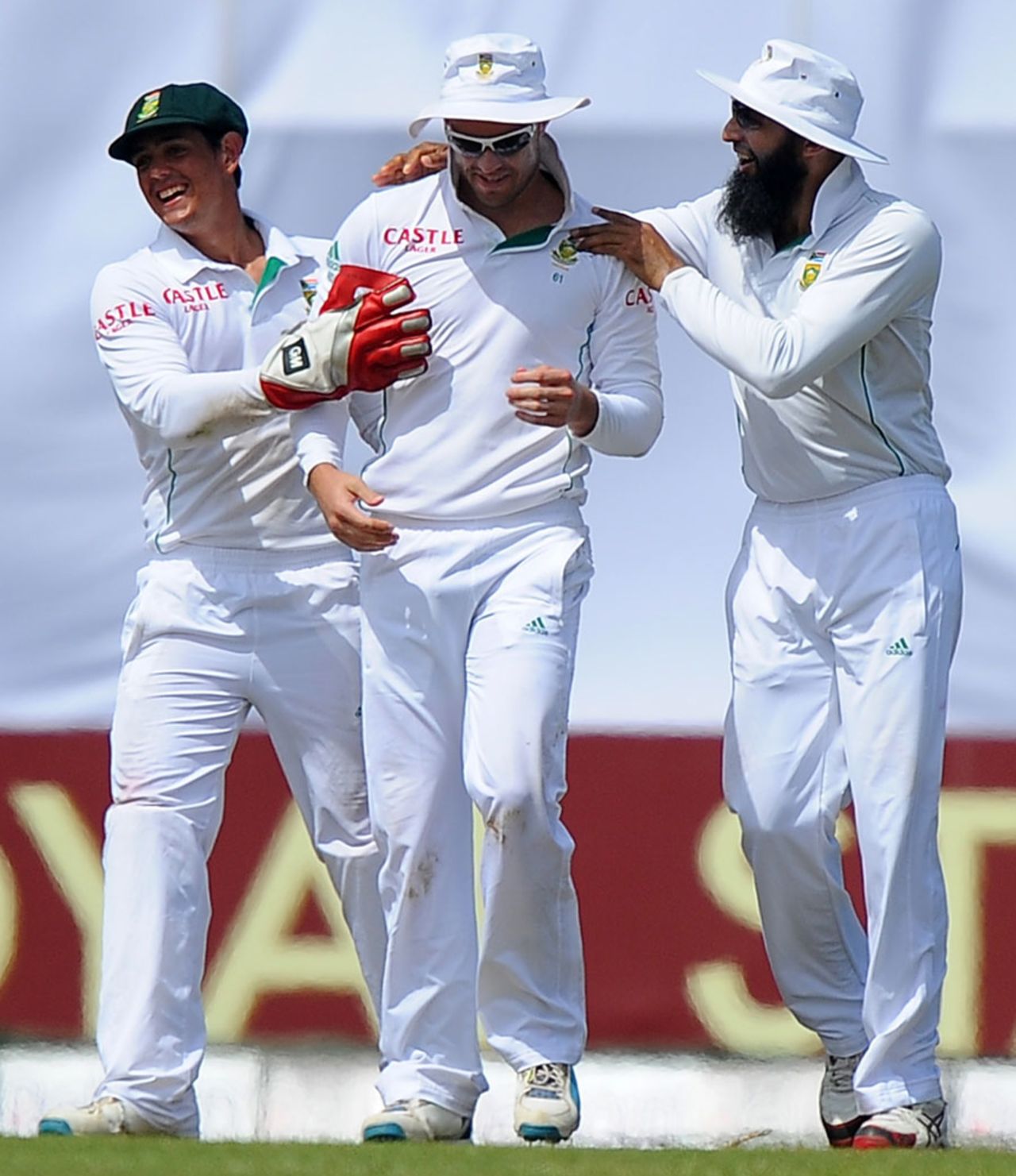 Quinton de Kock, AB de Villiers and Hashim Amla celebrate a wicket, Sri Lanka v South Africa, 1st Test, Galle, 4th day, July 19, 2014