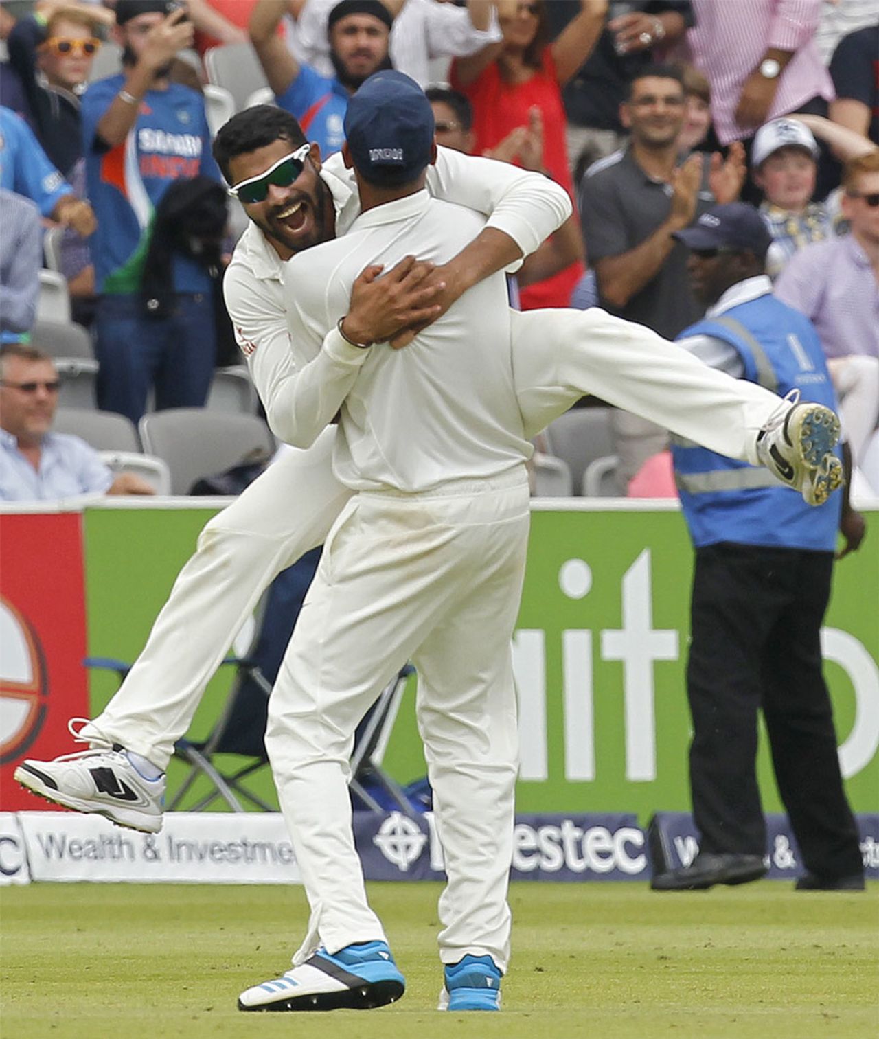 Ravindra Jadeja pounces on a team-mate during the celebrations, England v India, 2nd Investec Test, Lord's, 5th day, July 21, 2014
