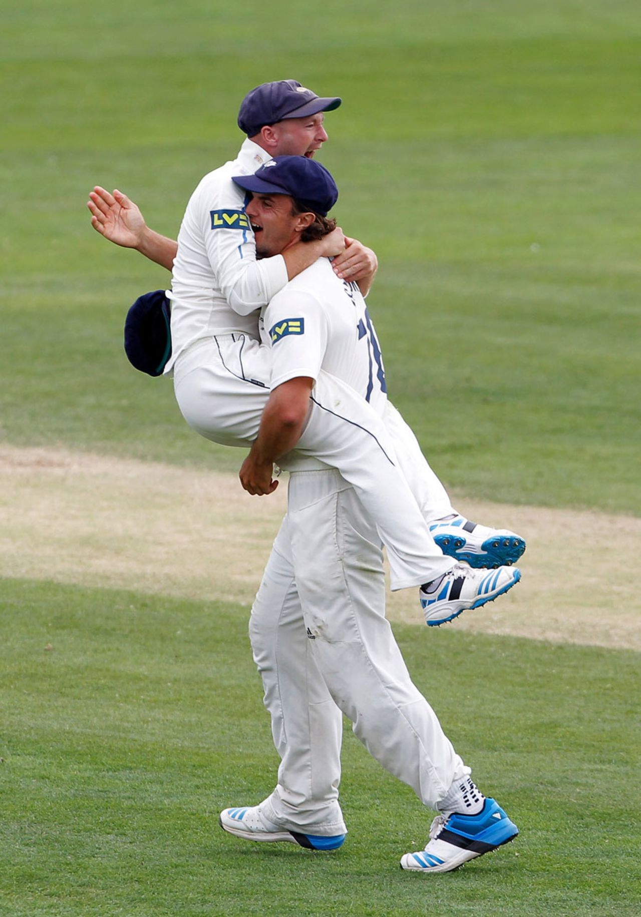 Adam Lyth and Jack Brooks celebrate victory, Yorkshire v Middlesex, County Championship, Division One, Scarborough, 4th day, July 22, 2014