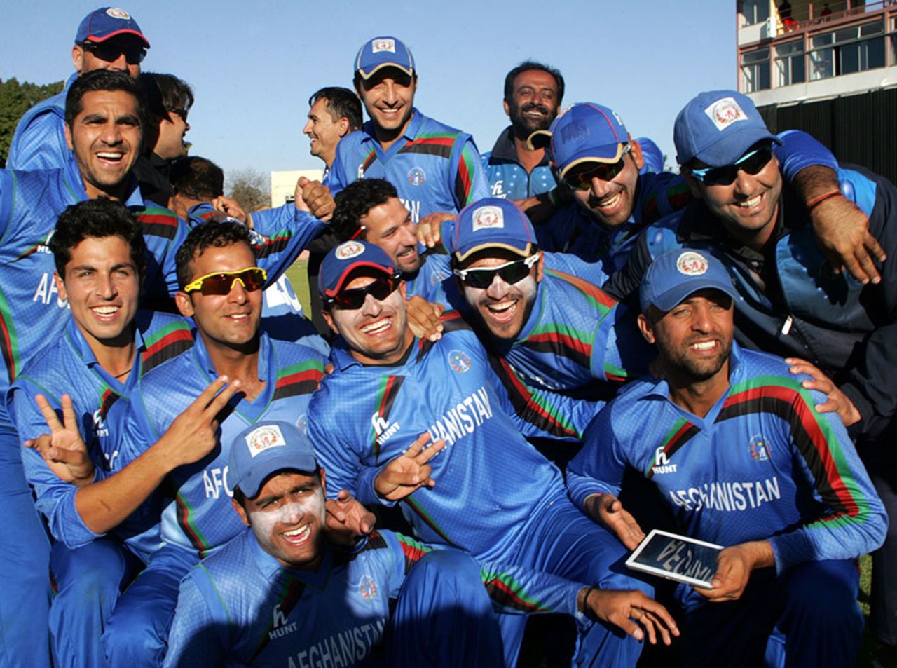 Afghanistan's players celebrate after winning the fourth ODI to draw the series 2-2, Zimbabwe v Afghanistan, 4th ODI, Bulawayo, July 24, 2014