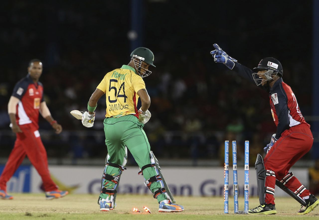 Lendl Simmons looks back to see his stumps shattered, Trinidad & Tobago Red Steel v Guyana Amazon Warriors, CPL 2014, Port-of-Spain, July 24, 2014