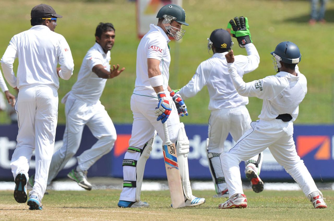 The Sri Lanka players celebrate the wicket of Dean Elgar, Sri Lanka v South Africa, 2nd Test, Colombo, 2nd day, July 25, 2014
